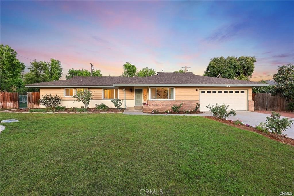 (Wide Frontage Of 131 x Depth 122 FT) A charming single-family home built in 1957,fantastic open floor plan offering a blend of classic design and modern comfort. The home boasts a Craftsman architectural style, characterized by its attention to detail and quality craftsmanship. Upgraded in 2015. including new Double pane windows,, New Garage Door, pristine Hardwood floors, Recently Fresh new paint interior, and much much more! Lovely cute covered patio was built along the rear of home, Kitchen was totally remodeled with new Stainless steel appliances, luxurious counter tops and premium quality cabinets. Family room features a lovely fireplace. Situated in a tranquil neighborhood, the property offers a wide backyard with a patio area, perfect for outdoor gatherings and relaxation. The location provides easy access to local amenities, schools, and parks, making it an ideal choice for families.