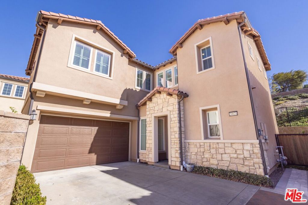 Welcome to an exceptional leasing opportunity in the exclusive Pointe Collection, located within the prestigious gated community of The Canyons in Porter Ranch. This immaculate "Zora" floor plan offers the perfect blend of modern elegance and functional design. With four spacious bedrooms and three full bathrooms, the home is thoughtfully laid out to accommodate a variety of lifestyles. A first-floor bedroom with an adjacent full bathroom is ideal for guests, a home office, or multigenerational living. Upstairs, you'll find three additional bedrooms, including an expansive primary suite with a private spa-like bathroom that boasts a soaking tub, separate shower, and dual vanities. A versatile loft area provides the perfect space for a playroom, media center, or home office whatever suits your needs. Outside, the backyard is a tranquil retreat, complete with a custom paver patio and lush turf lawn. It's the perfect setting for relaxing evenings or lively weekend gatherings. Living in The Canyons is about more than just a home it's a lifestyle. Residents enjoy access to a stunning resort-style community center that includes a beach-entry pool, splash pad, multiple spas, outdoor televisions, and a fully equipped outdoor kitchen, ideal for year-round entertaining. The location is unbeatable, just moments from the award-winning K8 Porter Ranch Community School and a short drive from The Vineyards, a premier shopping and dining destination. Don't miss this rare opportunity to lease a home that truly has it all luxury, comfort, and community. Schedule your private tour today and experience the best of Porter Ranch living.