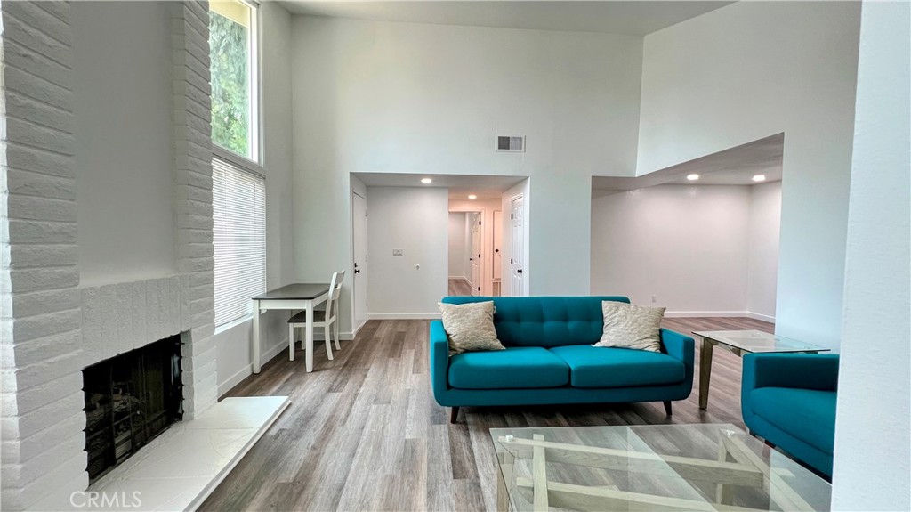 Beautifully Renovated 2-Bedroom, 2-Bathroom Condo for Lease! Step into this stylishly updated condo featuring 2 oversized bedrooms, including a spacious master suite with a luxurious en-suite bathroom. The bright living room boasts soaring vaulted ceilings and a cozy fireplace, creating the perfect space to relax. The dining area seamlessly connects to the fully updated galley-style kitchen, complete with-newer appliances and a modern design. The guest bathroom features a fully remodeled tub/shower combo and a sleek single vanity, while the master en-suite offers a double vanity and a custom walk-in shower. Enjoy laminate plank flooring and fresh paint throughout the home. The attached 2-car garage provides direct access to the kitchen for added convenience. Step outside to the charming patio—perfect for a BBQ, small table, and plants to create your own outdoor retreat. The community amenities include a sparkling pool and relaxing sauna. Conveniently located near shopping, dining, and easy freeway access, this condo offers both comfort and convenience.