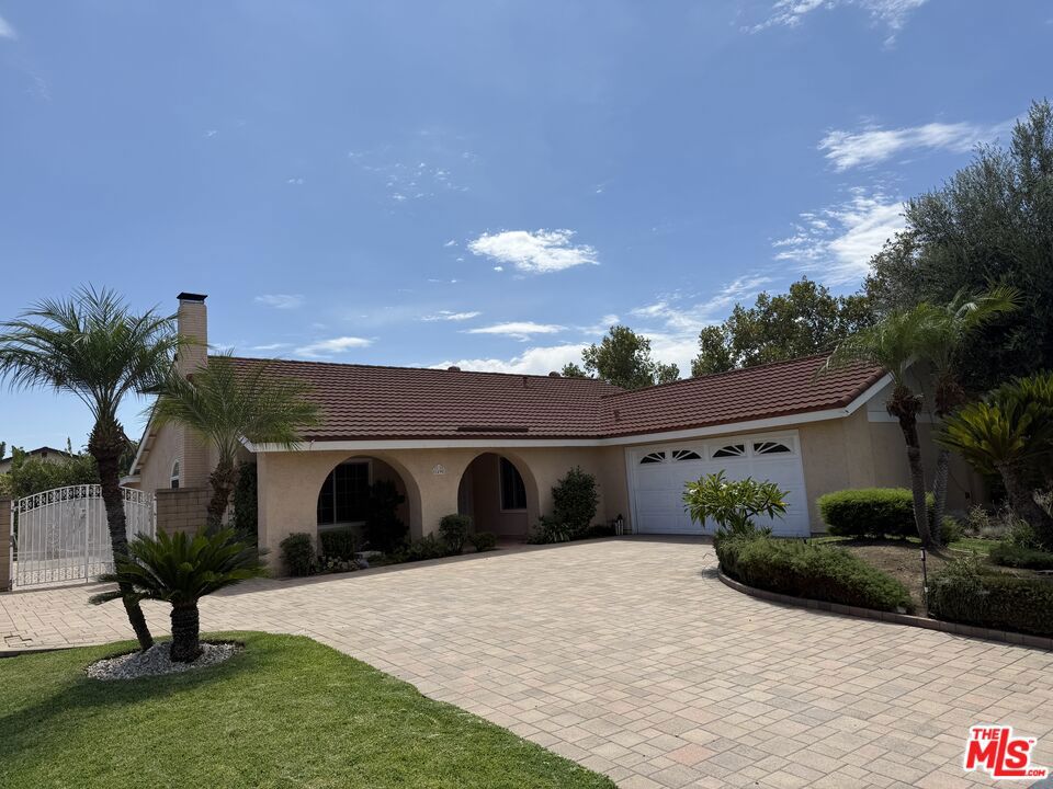 Modern single-story San Dimas Home for Lease. Discover this beautifully remodeled single-story home, ideally situated in the charming city of San Dimas. This 4-bedroom, 2-bathroom residence offers approximately +/-1,638 sq ft of contemporary living space. The open floor plan is filled with natural light from dual-pane windows, highlighting the stylish tile and wood floors throughout. The living room features a cozy fireplace, perfect for relaxing evenings. The kitchen is a chef's dream, with new appliances, abundant cabinet space, a refrigerator for your use, and great lighting. An enclosed bonus area adjacent to the kitchen provides a flexible space for a home office, playroom, or media room. Attached two-car garage with new washer and dryer. Step outside to a spacious backyard with a covered patio, creating an ideal setting for outdoor dining and entertaining. Bonita Unified School District. Tenant is responsible for all utilities. Tenant pays for watering landscaping, owner provides a monthly gardening service. No pets allowed. All applicants must apply through RentSpree. Gross household income must be at least 3x the monthly rent.