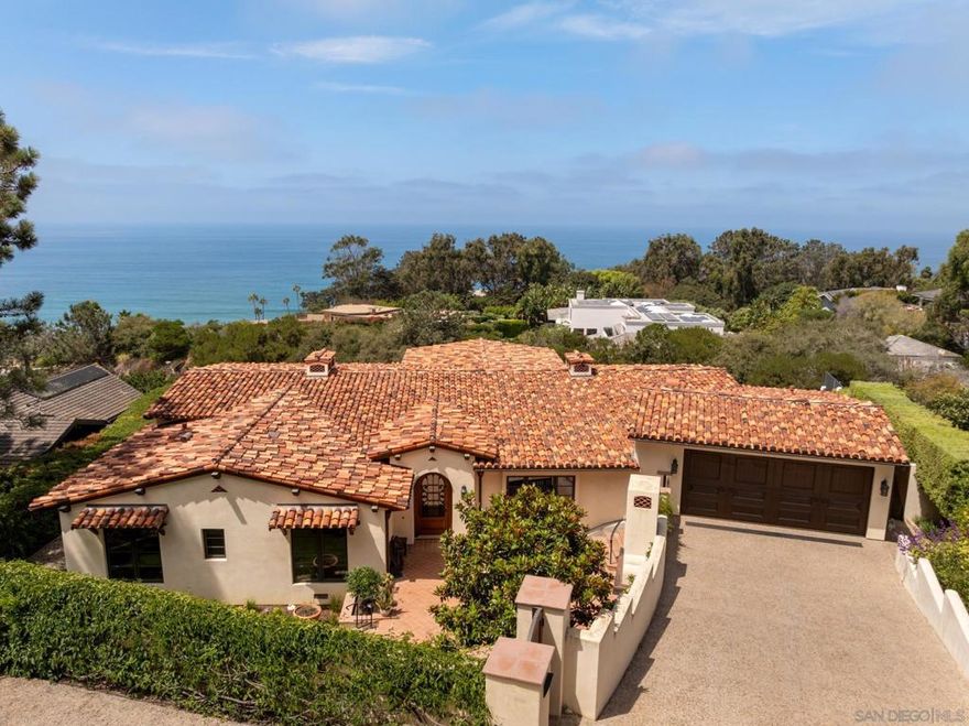 Welcome to 262 Ocean View, an extraordinary single-level residence on one of Del Mar’s most sought-after streets. Designed by renowned architects Bokal & Sneed, this home is just steps from the beach and village, capturing unobstructed ocean vistas and the true essence of Southern California coastal living. A gated entry opens to a spacious front courtyard with multiple seating areas, a grassy lawn, and an inviting outdoor fireplace. Inside, rich wood floors and beamed ceilings create warmth and character, while walls of glass frame endless blue horizons and blur the line between indoors and out. The great room flows seamlessly to an expansive ocean-view backyard retreat, complete with a covered wood deck, built-in heaters, multiple lounge and dining areas, and a full outdoor kitchen with BBQ and prep space. A newly added turf area offers the perfect spot for kids, pets, or quiet relaxation. The chef’s kitchen is both functional and beautiful, with custom cabinetry, marble and stone countertops, a floating island with bar seating, top-tier appliances, and a wine fridge—all framed by views of both the Pacific Ocean and the lush front courtyard. The primary suite is a private sanctuary with sweeping ocean views, direct deck access, two walk-in closets, and a spa-inspired bath with dual vanities, a soaking tub, and a glass-enclosed shower. Two additional guest suites overlook the front courtyard, each with its own full bath, while a fourth bedroom—currently styled as an office—opens directly to the backyard. A well-appointed laundry room, powder room...See Supplement...  The primary suite is a private sanctuary with sweeping ocean views, direct deck access, two walk-in closets, and a spa-inspired bath with dual vanities, a soaking tub, and a glass-enclosed shower. Two additional guest suites overlook the front courtyard, each with its own full bath, while a fourth bedroom—currently styled as an office—opens directly to the backyard. A well-appointed laundry room, powder room and a two-car garage with generous storage complete the layout.  Set along one of Del Mar’s most private and picturesque streets, 262 Ocean View offers timeless architecture, a rare single-level design, and the flexibility to expand with an ADU. This is coastal living at its finest.