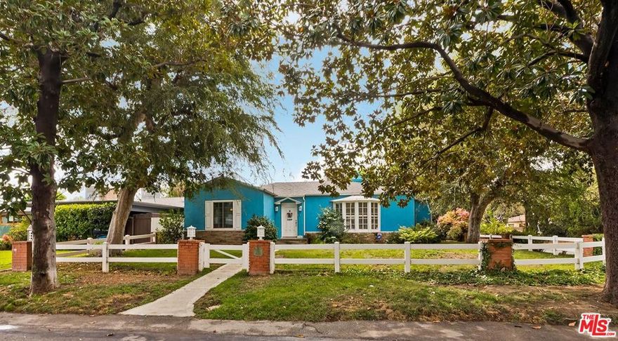 Fall in love with this rare 1936 Valley Village classic traditional with pool on an oversized corner lot. All the original elements you dream about blended with tasteful updates that honor the integrity of its classic style.  Step inside to a quintessential living room with a bay window and original fireplace. The dining room flows into an upgraded kitchen with expansive stone counters and stainless-steel appliances, including Viking stove top, Thermador double ovens, Bosch dishwasher. The enormous family room, with its beamed ceilings, feels like the heart of the home - opening through French doors to the backyard with pool, grassy yard and an office with slate floors, bay window and poolside views through French doors. The primary suite features a walk-in closet, spa-like bath with dual sinks, separate shower, soaking tub, and a private French door straight out to the pool. Additional spacious bedroom and bath, a bonus room, and flexible spaces make this home as functional as it is charming. Located in the coveted neighborhood of Valley Village, you'll love the neighborhood's tree-lined streets, friendly vibe, and top-rated schools, including Colfax Charter Elementary.  Adjacent to Studio City, Sherman Oaks, Toluca Lake, and North Hollywood with all the shops, cafes, and dining at your fingertips.  Savor the tranquility of this charming community, with easy access to downtown Los Angeles, Santa Monica, or a quick trip over Laurel Canyon to West Hollywood, and just minutes from Burbank Airport. Please submit offers by Friday, October 10 at 10am.