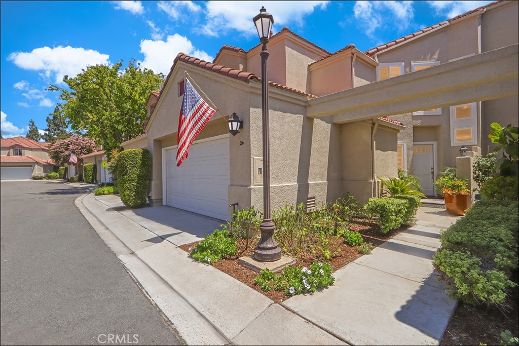 SPECTACULAR CUL-DE-SAC LOCATION WITH PANORAMIC VIEWS AND HIGHLY SOUGHT AFTER FLOOR PLAN WITH HIGH CEILINGS AND LOFT! Large foyer leading to a spacious living room with two-story ceilings and lots of windows to bring in plenty of natural light, large dining room, dual sided fireplace and sliding doors leading to the large and inviting patio with stone work, planters, covered patio area and spectacular views! Stunning Crema Marfil marble and rich Brazilian cherry hardwood flooring seamlessly come together and make the ultimate statement of elegance. Chef's kitchen with KitchenAid blacksteel appliances, 1 year new refrigerator and upgraded American cherry cabinets. Upgraded lighting and dimmer switches, upgraded HVAC system new as of July 2023, PEX Repiping as of 2020, upgraded dual glazed windows, upgraded Bradford White water heater, Halo 5 whole house water filtration system and so much more! This award winning floor plan offers a main floor office, den or can be the 3rd bedroom and bathroom with upgraded vanity, marble surround walk-in shower with frameless glass enclosure and upgraded fixtures. Open staircase leading to the spacious second story featuring a loft which is perfect as home office or den. Spacious master suite with vaulted ceilings and sliding door to the private deck with breathtaking views, walk-in closet and second closet, custom organizers and a spacious master bathroom with large vanity, dual sinks, separate tub and walk-in shower featuring marble surround, frameless glass enclosure and upgraded fixtures. Large 2nd bedroom with walk-in closet, built-in organizer and full second bathroom with tub and shower, glass enclosure and upgraded fixtures. Convenient inside laundry room with full size washer and dryer area and ample linen cabinets. Two car attached garage with custom cabinets and epoxy coated flooring. This property has it all plus the awesome California Renaissence community with resort style pool and spa, lots of greenbelts, easy toll road (73) and beach access (via 133), highly sought after schools, excellent proximity to Aliso Viejo Town Center, shops, restaurants and entertainment, within half a mile to the renowned Jack Nicklaus-designed golf course and nearby hiking, biking and nature trails!