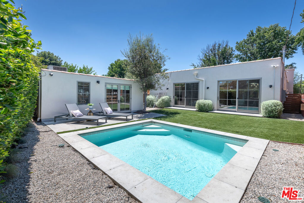 Spanish Revival Elegance in the Heart of Atwater Village. 4 Bed | 4 Bath | Pool | Guest House - This beautifully updated Spanish bungalow offers the perfect blend of classic charm and modern comfort in one of Atwater Village's most desirable locations. Featuring 4 bedrooms and 4 bathrooms across the main house and a detached, fully equipped guest house, the layout is ideal for flexible living. Step inside to discover sunlit interiors with wide-plank French oak floors, arched doorways, and French windows that frame garden views and invite in natural light. The bright, open floor plan flows seamlessly into a chef's kitchen outfitted with premium Thermador appliances and a generous dining and living areaperfect for entertaining. The spacious primary suite opens directly to the courtyard and pool and includes a walk-in closet and a spa-inspired ensuite bath. The detached guest house offers its own kitchenette, bathroom, Murphy bed, and large picture windowideal for guests, a creative studio, or home office.Outside, lush, mature landscaping surrounds a low-maintenance yard with turf and a sparkling dipping pool, creating a private oasis for relaxing or hosting. With upgraded systems throughout and a prime location near Atwater Village's best cafs, boutiques, and parks, this turnkey home is a rare opportunity to enjoy timeless design and modern ease. The ADU has it's own permitted address.