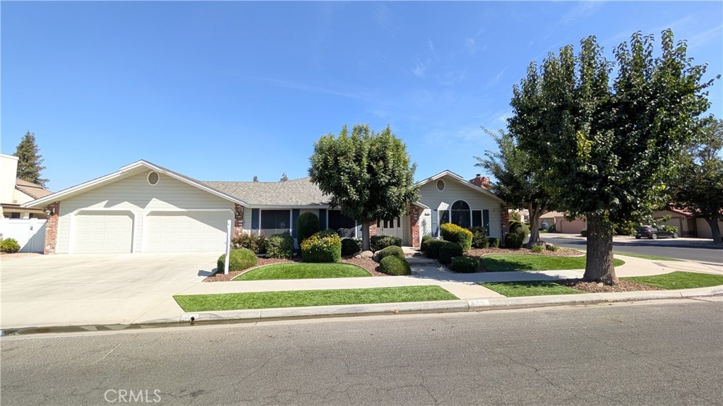 Welcome home to this pristine one-owner custom Berry Home. Located within walking distance to the Fresno River Trail and Lincoln Elementary School, you'll find this move-in ready home. Forget weekly yard maintenance, with synthetic laid down in the front and backyard, providing ample time to enjoy the rest of the home. Lots of mature landscaping with your own rose garden, and mature trees in the front of the yard. Step inside this home to fresh interior paint throughout, with a large living room open to the kitchen and dining area. Plantation shutters are located throughout the home offering privacy and style. The primary suite offers an oversized room with sunken jetted tub, spacious shower, and a walk-in closet. There is an attached large three car garage ideal for additional storage and your vehicles. You'll enjoy lots of shade and enjoyment in the backyard with synthetic lawn and covered patio, ideal for another dining space or entertainment space. Come take a look today and see for yourself.