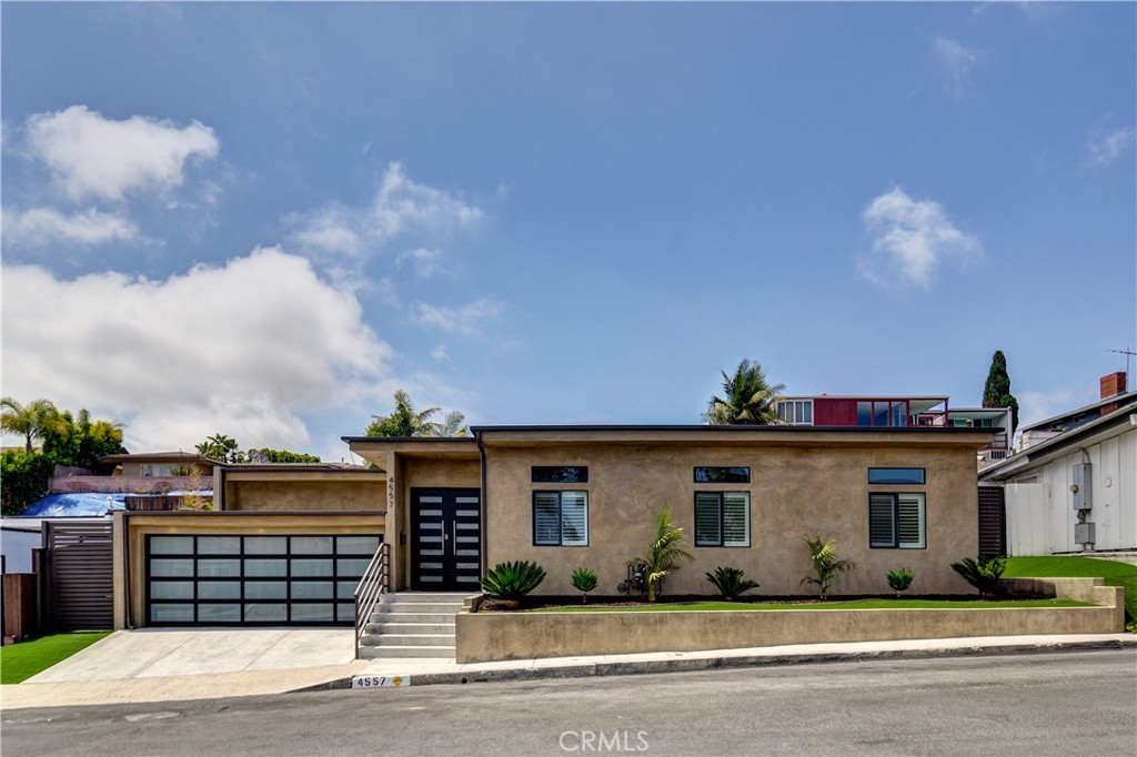 Located in the prestigious Baldwin Hills Estates affectionately known as “The Dons” this stunning 4 bedroom, 3 bathroom residence seamlessly combines contemporary elegance with the tranquility of nature. Set against the backdrop of one of Los Angeles' most historically affluent and culturally rich neighborhoods, this home offers a lifestyle of sophistication and comfort.
Step inside to discover an elegant foyer, open concept design, recessed lighting throughout, and high ceilings. The living room features a cozy fireplace, and French doors that open to the backyard, creating a harmonious indoor-outdoor flow. The state-of-the-art kitchen is a culinary enthusiast's dream, designed with lighting soffits, elegant shaker cabinets, sleek Bosch appliances, quartz countertops, and marble floors. Adjacent to the kitchen, the dining area provides the perfect setting for intimate dinners or lively gatherings. This home features 4 spacious bedrooms including a primary suite designed for comfort and convenience with a fireplace, large ensuite with mosaic and ceramic flooring adding charm and texter, and sliding glass doors add a seamless flow to the outdoor living space.
The beautifully landscaped backyard is a private retreat, featuring a serene hillside adorned with a cascading waterfall and a vibrant array of colorful plants and trees. An outdoor living room, complete with recessed lighting, a large built-in television and surround sound system, invites you to relax by the electric fireplace and enjoy out door entertainment. A separate fire pit area with comfortable seating offers an idyllic spot for evening conversations under the stars. The 2 car garage is fully finished offering a clean space ideal for various uses. This home is situated in a neighborhood with added peace of mind due to active security patrols.
Located minutes from Kenneth Hahn State Recreation Area, residents can enjoy access to hiking trails, a fishing lake, playgrounds, and picturesque picnic spots. The neighborhood's rich history and strong sense of community make it one of Los Angeles' most desirable places to live.
Experience the perfect blend of modern luxury and natural beauty in this exceptional Baldwin Hills home. Don't miss the opportunity to make this serene sanctuary your own.
