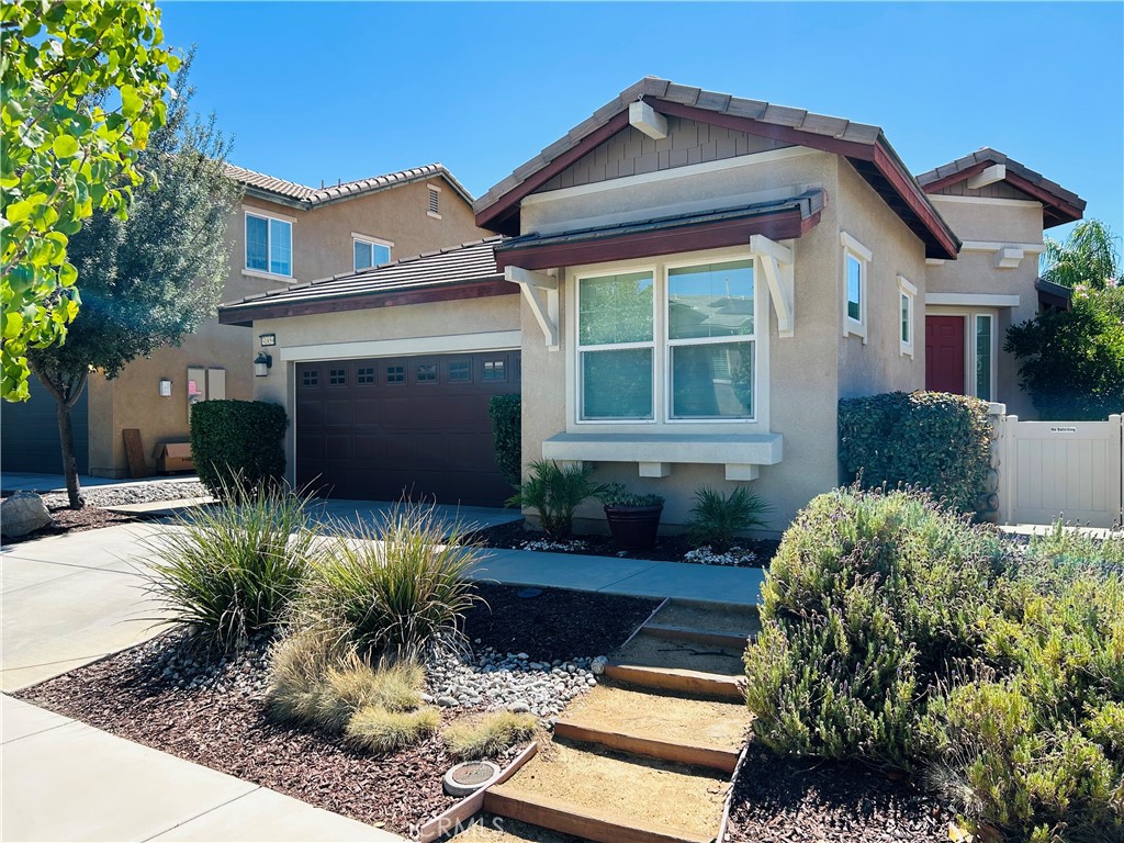 PROFESSIONAL PHOTOS COMING SOON. Come and see what awaits you with this wonderful opportunity to own an immaculate property in Murrieta! Located in the charming community of Rancho Bella Vista, this single-story floorplan has a desirable open concept complete with 3 bedrooms and 2 bathrooms across 1,672 square feet. As you walk inside the front door, you're greeted by a formal dining room that sets the stage perfectly for the kitchen and great room just around the corner. In a space created for entertaining, the kitchen boasts granite countertops, espresso shade cabinetry, and stainless-steel appliances along with a functional island. Stunning porcelain wood-look tile flooring and modern gray painted walls continue throughout the home as you make your way to the primary bedroom with ensuite bathroom. Some of the highlights there include dual vanities, a walk-in closet, a stand-alone shower, and a soaking tub ideal for unwinding after a long day. The two guest bedrooms are conveniently located towards the front of the home with one room having a window to the front of the property, making it an inviting space for a potential home office. Other interior features include high ceilings, window shutters, ceiling fans, and a tankless water heater. Step into the backyard to find a peaceful oasis-like outdoor space with mature trees, lush grass lawn, and an inviting patio area with a built-in bar and Alumawood patio cover. Solar panels complete the list of highlights and give you a significant advantage on how your home is powered. Set up a private showing today so you don't let this beautiful residence pass you by!