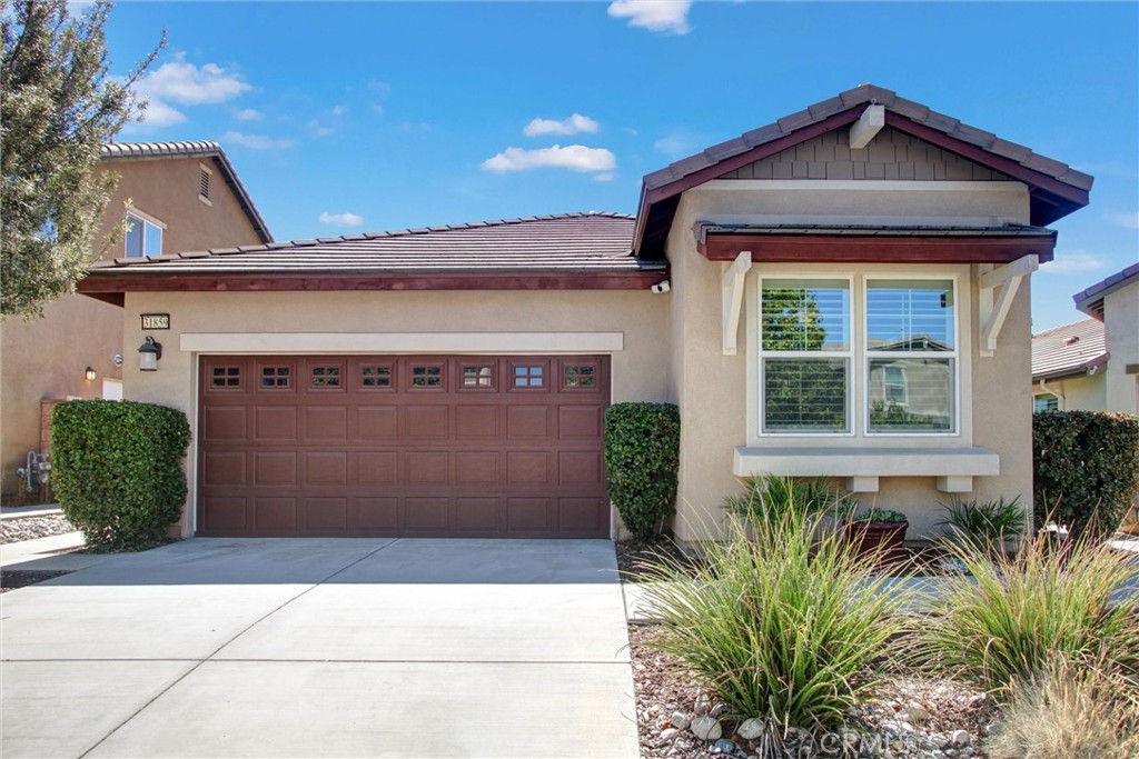 Come and see what awaits you with this wonderful opportunity to own an immaculate property in Murrieta! Located in the charming community of Rancho Bella Vista, this single-story floorplan has a desirable open concept complete with 3 bedrooms and 2 bathrooms across 1,672 square feet. As you walk inside the front door, you're greeted by a formal dining room that sets the stage perfectly for the kitchen and great room just around the corner. In a space created for entertaining, the kitchen boasts granite countertops, espresso shade cabinetry, and stainless-steel appliances along with a functional island. Stunning porcelain wood-look tile flooring and modern gray painted walls continue throughout the home as you make your way to the primary bedroom with ensuite bathroom. Some of the highlights there include dual vanities, a walk-in closet, a stand-alone shower, and a soaking tub ideal for unwinding after a long day. The two guest bedrooms are conveniently located towards the front of the home with one room having a window to the front of the property, making it an inviting space for a potential home office. Other interior features include high ceilings, window shutters, ceiling fans, and a tankless water heater. Step into the backyard to find a peaceful oasis-like outdoor space with mature trees, lush grass lawn, and an inviting patio area with a built-in bar and Alumawood patio cover. Solar panels complete the list of highlights and give you a significant advantage on how your home is powered. Set up a private showing today so you don't let this beautiful residence pass you by!