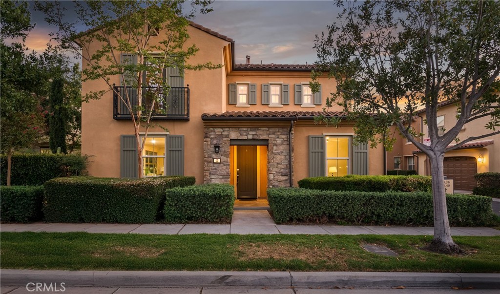 Nestled in the highly sought-after Sevilla subdivision of Portola Springs, this stunning residence welcomes you with nine-foot ceilings throughout and an open floor plan ideal for both entertaining and everyday living. The gourmet kitchen features porcelain-tile flooring, granite countertops, stainless-steel appliances, a central island with bar seating, and rich wood cabinetry. Double sliding glass doors seamlessly connect the living areas to one of the subdivision’s largest backyards, offering plenty of room for outdoor dining and recreation. The first floor also includes a private bedroom suite with a full bathroom and premium oak engineered-hardwood flooring. A beautiful staircase of premium solid-oak treads leads upstairs, where premium maple engineered-hardwood flows through the hall and secondary bedrooms. The spacious master suite is bathed in natural light from multiple windows, offering a generous walk-in closet and a luxurious en-suite bathroom with premium marble flooring, granite sink tops, dual vanities, a walk-in shower, and a standalone tub. A well-placed laundry room completes the second level. Other standout features include a serene location on a quiet, private road; LED lighting throughout; a whole-house water filtration system; and an attached two-car garage with ample street parking. All of this is perfectly situated within the Portola Springs Community, where over 20 neighborhood parks, sports courts, Olympic-size swimming pools, and clubhouse spaces await—plus top-rated schools in the Irvine Unified School District.