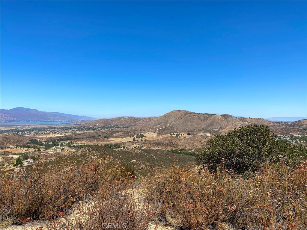 Price Improvement! - Looking for your own mountain top to build on? Absolutely beautiful views from the flat parcel atop this property! An excellent opportunity to own a large parcel of land with unobstructed panoramic views all the way to Lake Elsinore. Get off the grid! Build your hilltop dream home with 20 Acres of undeveloped land just above “The Farm” development in Wildomar. Not too close, but not too far. Currently gated, the entrance is located in the Farm, on Olive Grove Road, near the two water towers owned by The Farm. A private dirt road owned by the owner of this parcel, takes you through the chapparal up part of the way, the parcel goes to the top of the ridge giving you panoramic views for miles and miles. Additionally, there is an easement off of Baxter Road.
Buyer to do their due diligence. Information is deemed reliable but not verified by listing agents.