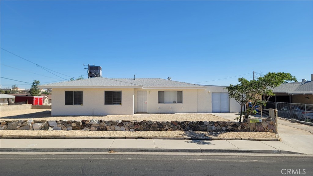 Welcome to this spacious and updated 4-bedroom, 1.75-bath home located in a centrally situated Barstow neighborhood. This property features a functional layout with modern upgrades and preserved charm, offering a great opportunity for owner-occupants or investors.
Recent improvements include a newer roof, newer central A/C system, luxury waterproof vinyl plank flooring throughout, remodeled bathrooms, and fresh paint inside and out. The kitchen maintains its original cabinets and countertops, providing an opportunity for personalization.
The home includes a large primary suite with a private ¾ bath. This space was created from a previously drywalled and built-out garage; the bathroom was added as part of recent renovations. Permit status for this conversion is unknown. Buyer to verify all information and conduct their own due diligence.
Public records reflect 3 bedrooms, 1 bathroom, and 1,109 sq ft. The current layout includes 4 bedrooms and 1.75 bathrooms.
Conveniently located near schools, shopping, and major highways. Additionally, Barstow is set to benefit from the approved $1.5 Billion BNSF Barstow International Gateway Project, which is expected to bring significant long-term economic growth, job opportunities, and infrastructure improvements to the area.
