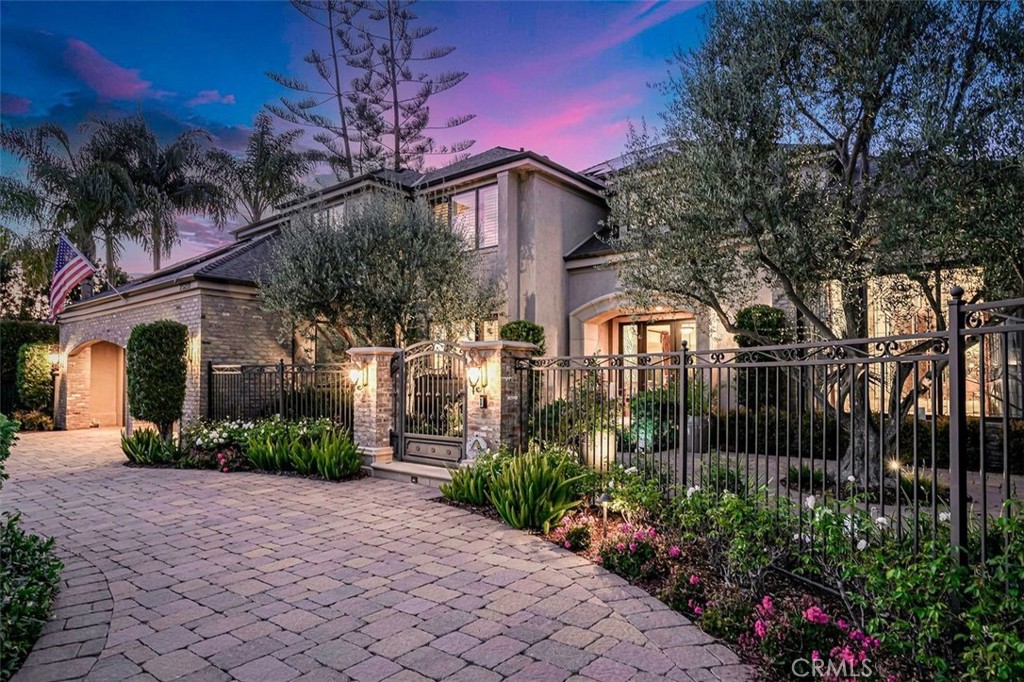 Welcome to your own private oasis in the exclusive equestrian community of Nellie Gail Ranch—where luxury, comfort, and resort-style amenities come together in a premier cul-de-sac setting. Backing to miles of scenic horse trails, this impressive estate offers 5 bedrooms, 4.5 bathrooms, and a 3-car garage across 5,473 square feet of elevated indoor-outdoor living on nearly half an acre.
Step into the grand foyer and be greeted by a dramatic two-story living room, soaring vaulted ceilings, and an abundance of natural light. The open-concept floorplan flows effortlessly from formal living and dining areas into a chef’s dream kitchen, expansive family room, and wet bar—creating the perfect space for entertaining and everyday living.
The main level features a flexible en-suite bedroom and a custom-built office ideal for remote work or creative pursuits. Upstairs, the luxurious primary suite is a private retreat with serene views, a spa-inspired bath, custom walk-in closet, and a private deck off the bathroom for peaceful morning escapes.
Designed for year-round alfresco living, the backyard is a true showstopper: covered patio with built-in heaters, a Viking-equipped outdoor kitchen, fireplace lounge with TV, pool and spa, soothing fountain, golf putting green, basketball court, and lush, mature landscaping lit by custom exterior lighting.
Additional upgrades include a semi-circular paver driveway, striking new glass entry doors, all-new windows and sliders, fresh interior and exterior paint, all-new hardwood flooring, a comprehensive DCS Home Security System, full home PEX re-pipe, and a fully owned 14.01 kWh SunPower solar system.
Enjoy Nellie Gail’s world-class amenities, including tennis and pickleball courts, clubhouse and restaurant, horse stables with on-site trainers, community pool and spa, scenic parks, equestrian arenas, and extensive trail networks—all with easy access to the 73 Corridor (toll-free heading south).
More than just a home, this is a lifestyle—refined, relaxed, and distinctly California.