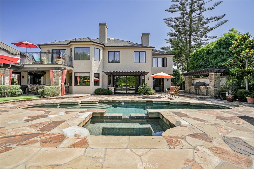 Welcome to your own private oasis in the exclusive equestrian community of Nellie Gail Ranch—where luxury, comfort, and resort-style amenities come together in a premier cul-de-sac setting. Backing to miles of scenic horse trails, this impressive estate offers 5 bedrooms, 4.5 bathrooms, and a 3-car garage across 5,473 square feet of elevated indoor-outdoor living on nearly half an acre.
Step into the grand foyer and be greeted by a dramatic two-story living room, soaring vaulted ceilings, and an abundance of natural light. The open-concept floorplan flows effortlessly from formal living and dining areas into a chef’s dream kitchen, expansive family room, and wet bar—creating the perfect space for entertaining and everyday living.
The main level features a flexible en-suite bedroom and a custom-built office ideal for remote work or creative pursuits. Upstairs, the luxurious primary suite is a private retreat with serene views, a spa-inspired bath, custom walk-in closet, and a private deck off the bathroom for peaceful morning escapes.
Designed for year-round alfresco living, the backyard is a true showstopper: covered patio with built-in heaters, a Viking-equipped outdoor kitchen, fireplace lounge with TV, pool and spa, soothing fountain, golf putting green, basketball court, and lush, mature landscaping lit by custom exterior lighting.
Additional upgrades include a semi-circular paver driveway, striking new glass entry doors, all-new windows and sliders, fresh interior and exterior paint, all-new hardwood flooring, a comprehensive DCS Home Security System, full home PEX re-pipe, and a fully owned 14.01 kWh SunPower solar system.
Enjoy Nellie Gail’s world-class amenities, including tennis and pickleball courts, clubhouse and restaurant, horse stables with on-site trainers, community pool and spa, scenic parks, equestrian arenas, and extensive trail networks—all with easy access to the 73 Corridor (toll-free heading south).
More than just a home, this is a lifestyle—refined, relaxed, and distinctly California.