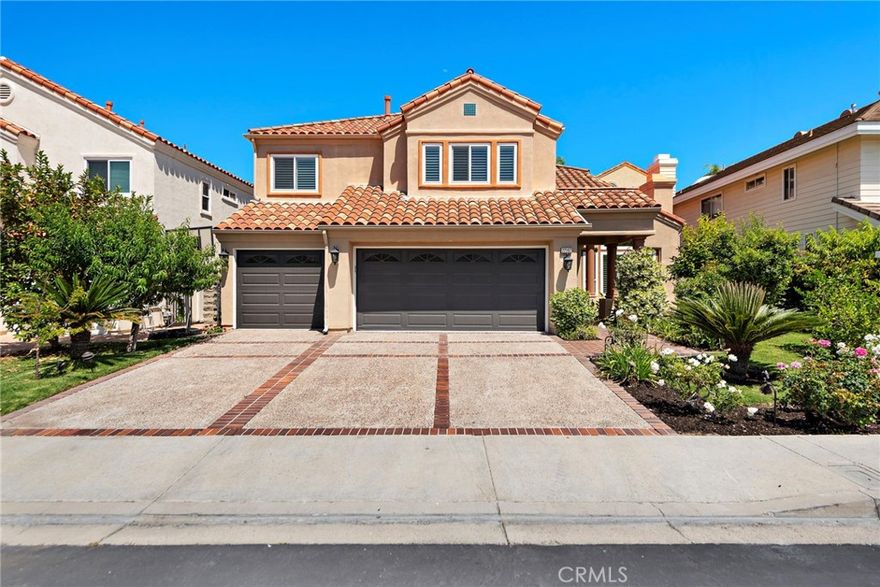 Set in the coveted, guard-gated community of Canyon Crest, this highly upgraded home offers an open floorplan and amenities perfect for entertaining. As you enter the property through the wrought iron front door you are greeted by soaring ceilings and an elegant chandelier. High ceilings in the living room and dining area provide an open airy feeling and a main floor bedroom (currently converted to an office) as well as an upgraded main floor full-bath provide added comfort and functionality. PROPERTY JUST UNDERWENT MAJOR RENOVATIONS TO CONVERT BONUS ROOM INTO SECOND PRIMARY SUITE WITH FULL EN-SUITE BATH! New flooring upstairs! The modern, upgraded kitchen is the focal point of the home. A quartz waterfall island and breakfast bar provide tons of space for dining and cooking. Lighting fixtures and backsplash provide sophistication and new appliances throughout the kitchen top it all off. A conveniently located pantry ensures that you will never run out of space. The kitchen seamlessly transitions to the family room, providing a perfect area to gather. Around the corner you will find a sleek wet bar equipped with a wine refrigerator. Upstairs, you will find the spacious primary suite with a long balcony to relax on. A fireplace, walk-in closet and updated primary bath provide a resort-like experience. Down the hall you will find two Jack and Jill bedrooms with an upgraded full bath shared between the two of them. At the end of the hall you will find the new en-suite bedroom, providing comfort and functionality. Downstairs, the home boasts a 3-car garage and a spacious laundry room with room for side by side Washer and Dryer, as well as tons of cabinets for storage. Outside you will find a hardscaped backyard with a built in barbecue island, fireplace and waterfall. The backyard and front yard are adorned with beautiful fruit trees producing a wide variety of fruits. The property underwent ADDITIONAL UPGRADES in 2023-2024 including brand new Milgard doors/windows, the home was repiped, new AC, new whole home water filtration system, new chandelier, new appliances and MUCH MORE! The 24 hour guard-gated community of Canyon Crest boasts endless amenities including 4 pools, spa, clubhouse, fitness center, tennis and racketball courts, playground, basketball court, BBQ area and much more! The home is located a short distance from Lake Mission Viejo, dining and other amenities.