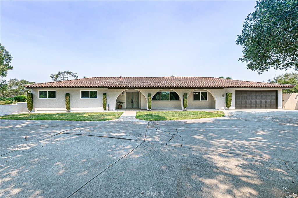 Nestled in the coveted Mesa Oaks community, this fully renovated home sits on a picturesque ¾-acre lot shaded by mature oaks. A private circular driveway leads to an oversized two-car garage, RV parking, and inviting double-door entry. Inside, you'll find 3 bedrooms, 2.5 baths, and a thoughtful floor plan that blends style and comfort. The step-down formal living room and elegant dining area set the stage for entertaining, while the family room with a cozy fireplace opens to a chef's kitchen. Outfitted with top-tier stainless appliances, soft-close cabinetry, quartz counters, sweeping tile backsplash, built-in wine fridge, and a coffee bar, this kitchen is as functional as it is beautiful. An enclosed patio room offers extra space for work, play, or relaxation. Light fills the home through dual-paned windows and sliders, leading to a backyard designed for gatherings—complete with an outdoor BBQ, storage shed, and endless possibilities. The spacious primary suite features a walk-in closet, upgraded bath with premium finishes, and direct access to the yard. Recent upgrades include custom lighting, new flooring, fresh paint, and quality fixtures throughout. With no HOA, a half bath in the garage, and easy access to Vandenberg Space Force Base, Highway 1, and Santa Barbara, this home puts you close to world-class wine tasting, the historic La Purísima Mission, and even local rocket launches. You won't want to miss the chance to make this dream home yours!