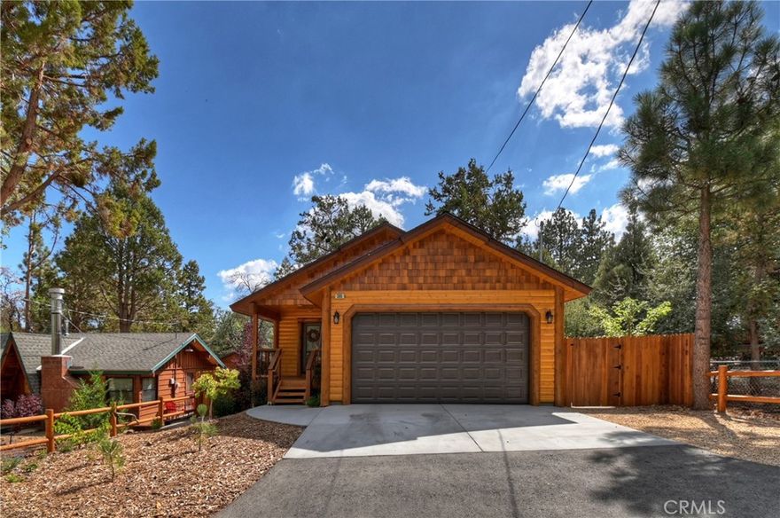 Welcome to this beautifully crafted 3-bedroom, 2-bath home nestled in the serene Big Bear Pine Wood subdivision. Blending rustic charm with contemporary features, this home offers an inviting open-concept layout perfect for both everyday living and entertaining. The spacious kitchen is a chef’s dream, featuring stainless steel appliances, custom cabinetry, and sleek granite countertops. Gather around the artisan-built redwood dining table with custom seating — perfect for cozy dinners or hosting friends and family. Both bathrooms are generously sized and include Bluetooth-enabled exhaust fans, bringing modern convenience to your daily routine. Enjoy the practicality of a 2-car attached garage, offering ample parking and storage. A 6-foot redwood fence surrounds the property, ensuring privacy and peace of mind. Outside, a thoughtfully designed mix of hardscape and landscaping creates a functional 360-degree walk-around — ideal for enjoying the fresh mountain air in every season. This home truly offers the best of Big Bear living. Don’t miss your chance to own this unique blend of mountain serenity and modern comfort!