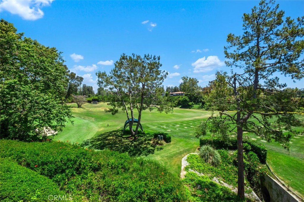 Elegant Single-Level Custom Home in Prestigious Big Canyon. Tucked away at the end of a peaceful cul-de-sac in the prestigious guard-gated community of Big Canyon, this exceptional single-level custom home offers privacy, comfort, and sweeping golf course views.Featuring 6 spacious bedrooms, 5.5 bathrooms, and a versatile den, the home is thoughtfully designed for both everyday living and elegant entertaining. The luxurious primary suite includes dual amenities, while a large atrium fills the interior with natural light. Beautiful hand-hewn oak floors, formal living and dining rooms, and a generous family room with a state-of-the-art media center complete the interior.Outdoors, enjoy a large sport court, manicured grounds, and expansive views of the Big Canyon golf course. A spacious 3-car garage provides ample storage and convenience.Blending timeless traditional style with modern comforts, this home offers a rare opportunity for single-level living in one of Newport Beach’s most exclusive communities.