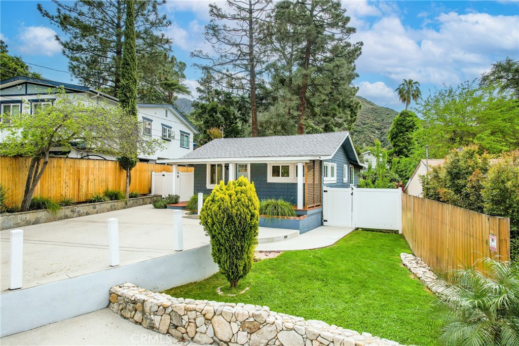 Welcome to this beautifully upgraded home in La Crescenta’s desirable Upper Briggs Terrace! This charming residence offers 3 bedrooms and 2 bathrooms across approximately 1,337 square feet of thoughtfully renovated living space. Additionally, a detached 100-square-foot structure—complete with its own AC/heating, recessed lighting, and laminate flooring—serves as a perfect office, studio, or workshop. Situated on a spacious 7,050-square-foot lot, the home was fully renovated in 2020, with recent enhancements including new fencing, a 360-degree security system, and updated appliances. The open-concept floor plan welcomes you into a bright living room, seamlessly flowing into a central kitchen and a dining/den area highlighted by rustic wood beams. Large doors lead to a spacious backyard and an entertainer’s deck—ideal for outdoor dining, gatherings, or peaceful relaxation. The private primary suite features an en-suite bathroom, walk-in closet, and direct access to the tranquil backyard—a perfect spot for morning coffee or evening unwinding. The property also offers ample parking with space for up to five vehicles in the driveway and courtyard. Don't miss this incredible opportunity to lease a move-in-ready gem in one of La Crescenta’s most sought-after neighborhoods!