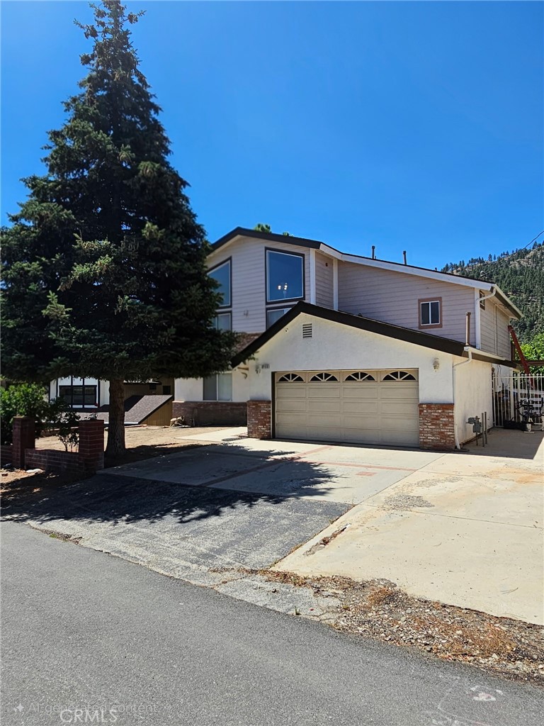 Hello & Welcome to this beautiful five-bedroom, three bath home/cabin in the charming San Gabriel Mountain town of Wrightwood California surrounded by beautiful Pine filled mountains. **SEE 2 VIRTUAL 360 VIDEOS EXTERIOR & INTERIOR** Functional layout with and upscale finishes in a serene natural setting. Ideal for family or hosting guests. 2 master suites, one down the other up. Open concept living with vaulted ceilings and exposed beams. Front and rear deck/patio areas for a morning coffee or to relax in the evening Ideal as a vacation retreat, full time residence, rental property or a potential AIR BNB. Trails for hiking, cycling and skiing & snowboarding just minutes away. Year around appeal. Quiet mountain living and yet just minutes from the quaint downtown area of Wrightwood where you'll find a variety of shops, cafes and restaurants. Just minutes from Mtn High Resort. Fully accessible located only 15 minutes west of the 15 frwy at the 138 exit