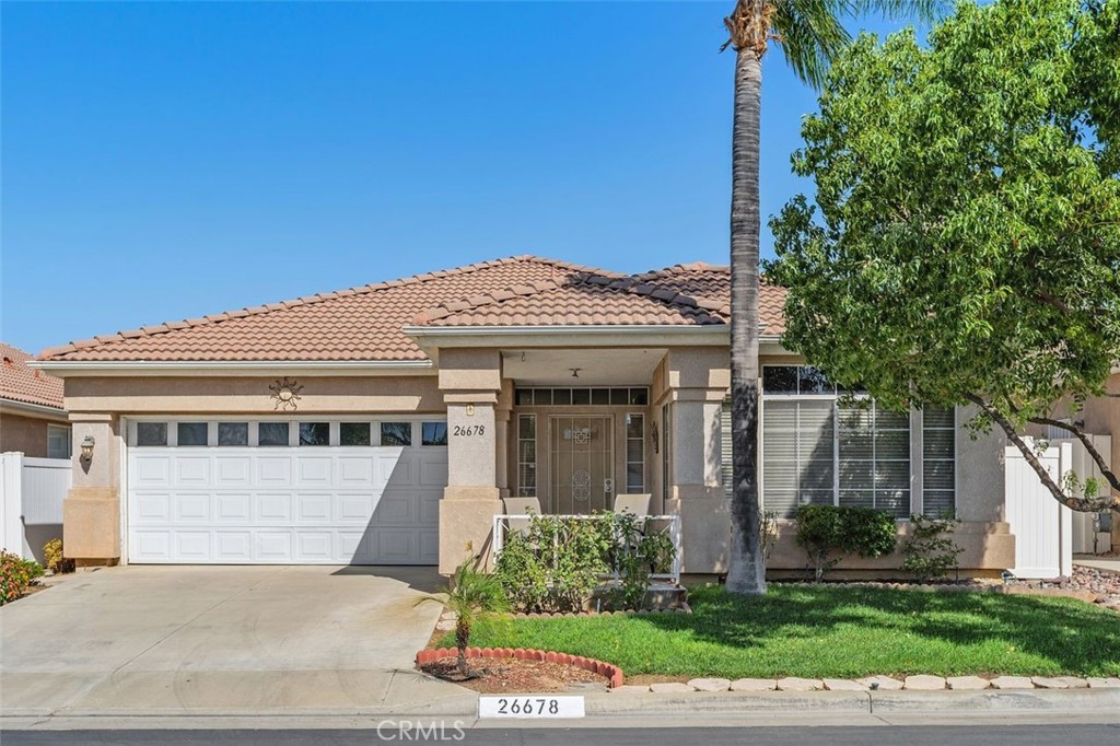 This two bedroom home is conveniently located in a gated community in South West Riverside! One of the most sought after 55+ gated communities in the area, this home features recessed lighting, ceiling fans, and custom window coverings throughout. The primary suite includes raised ceilings for a spacious feeling and ensuite bathroom with dual vanity sinks and step in shower. The guest bedroom offers cozy direct access to the guest bathroom for added privacy. The open living and dining area areas are enhanced by a warm fireplace, wood floors, and durable tile flooring in high traffic areas. RV parking is available within the community for a small the residence of The Club! Enjoy low HOA dues and a wide range of amenities, including a sparkling pool and spa barbecue area, game and exercise rooms, tennis courts, a library, and dedicated spaces for bingo, billiards and social events. Conveniently located near shopping, grocery stores, gas stations, and freeway access, this home offers the perfect combination to relaxed, dream-living style living and every day conveniences!