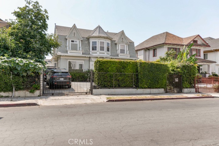Welcome to a truly remarkable opportunity to own a beautiful and spacious home ideally located near the heart of Los Angeles. This 5-bedroom, 3-bathroom residence offers an expansive 2,626 square feet of living space, providing an exceptional blend of comfort and functionality.
Step inside and be greeted by a bright and airy atmosphere, where the spacious living room, adorned with detailed crown molding and fireplace sets the stage for relaxing evenings and lively gatherings. The separate formal dining room is perfect for hosting dinner parties, while the updated kitchen is a standout feature, offering a modern and inviting space for all your culinary adventures. You'll enjoy the convenience and privacy of a front electric gate for easy access in and out.
The generous 6,160-square-foot lot provides ample outdoor space for gardening, play, or future expansion. A significant bonus is the property's zoning of LARD1.5, which allows for multiple dwellings and offers incredible potential for savvy investors or those looking to add an Accessory Dwelling Unit ADU for rental income or multi-generational living.
This home’s prime location gives you the best of city life without the daily hassle. You'll have quick and easy access to the 10 and 110 freeways, making commutes and weekend trips a breeze. Enjoy being just moments away from the vibrant culture, dining, and entertainment of downtown Los Angeles.
This isn't just a house. It's a fantastic investment and a place to call home.
