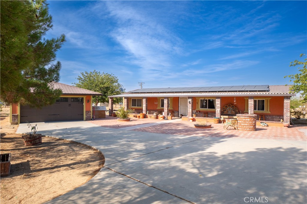 Beautiful recently renovated mini style hacienda property that sits on a spacious 2.07 acre corner lot that welcomes you into an open floor plan, wood kitchen cabinets with granite countertops, laundry area, 3 beds and 2 baths. Large 2 car garage with workshop area. Fenced, garden spot, area for chickens, horse round pen and horse stables. MUST SEE TO APPRECIATE!!!