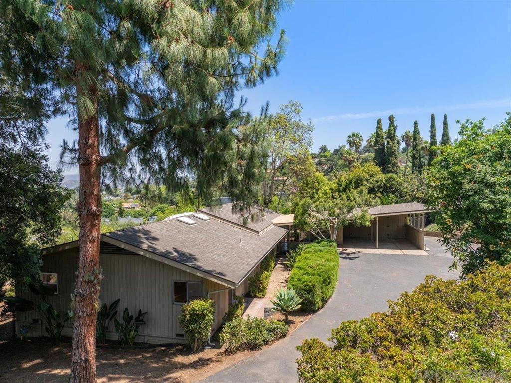 Charming contemporary style one-level home with detached guest house on 1.4 acres within walking distance of downtown Escondido. Main home features 2 large bedrooms plus a room that could be used as a 3rd bedroom. Enjoy panoramic views thru the dramatic picture window in the living room and from the huge back patio and deck. The guest house is totally separate and privet from the main home. It has a full bath, kitchenette, large private back deck and separate driveway for parking.