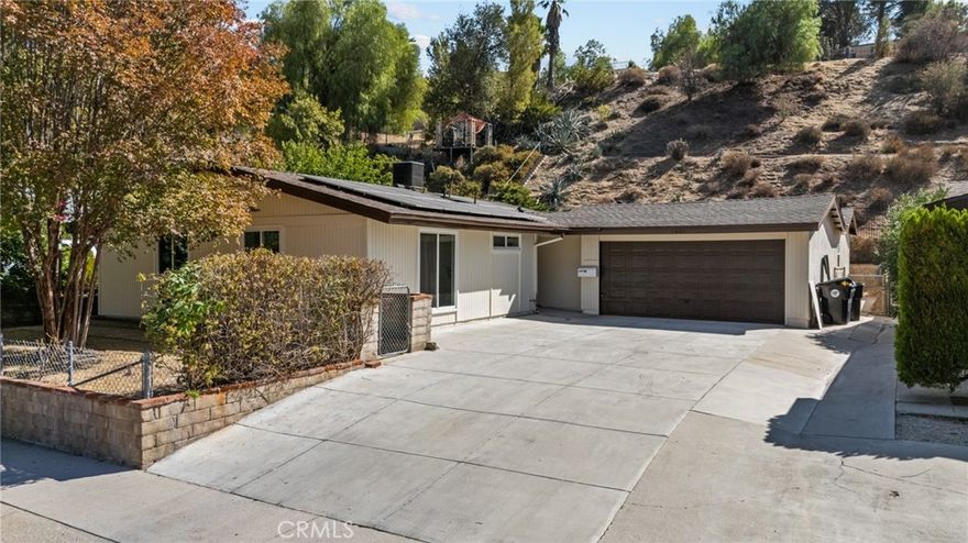 Welcome to 18816 Darter Dr! A fully remodeled Canyon Country gem! This stunning home features new flooring throughout, updated bathrooms with modern tile, sinks, tubs, and a sleek kitchen with quartz countertops and recessed lighting. Enjoy energy efficiency with paid solar and a permitted studio ADU in the back complete with a full bath, perfect for guests, rental income, or extended family. Plus, a spacious 2-car garage and a great location near shops, schools, and parks