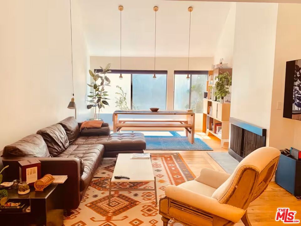 Modern 2-Bed + Loft in Prime West Hollywood Rooftop Views, Remodeled, and Resort-Style Amenities. Welcome to this beautifully remodeled 2-bedroom, 2-bathroom condo located in one of West Hollywood's most sought-after communities on Kings Road. Each spacious bedroom is a private suite with its own en-suite bathroom, offering ultimate comfort and privacy. A unique bonus loft on the second floor, perfect for a home office or creative space, overlooks the bright and airy living room, which boasts soaring double-height ceilings and abundant natural light. The open-concept design flows seamlessly throughout the home. Enjoy a rare in-unit laundry, a spacious private rooftop patio with stunning views of the Hollywood Hills, ideal for grilling and relaxing under the Southern California sky. This unit is available furnished or unfurnished, and the lease includes water, gas, trash, and WiFi. The community offers resort-style amenities including a sparkling pool and spa, a well-equipped gym, a clubroom, tranquil waterfalls, and meticulously landscaped greenways. Don't miss this opportunity to live in a peaceful, amenity-rich enclave just moments from all that West Hollywood has to offer.