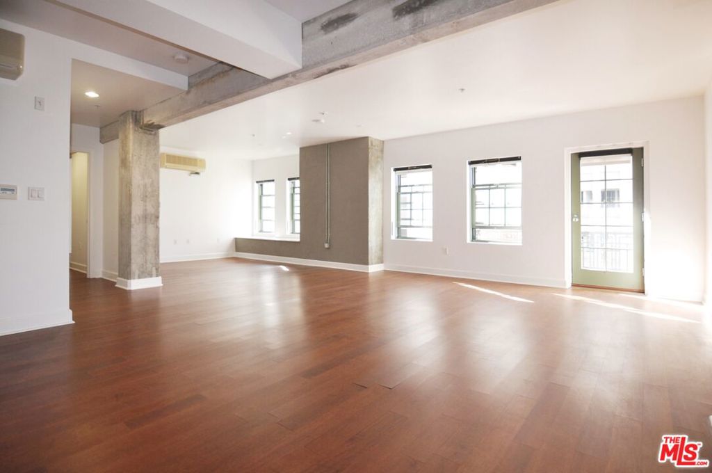 Charming 2 bed, 2 bath in the historic landmark Art Nouveau building, El Dorado, where Charlie Chaplin once resided. The boutique-style building features only 65 units, and this unique 1100sf west-facing, 8th floor residence gets beautiful natural light from its many windows, and has one of the few front-facing private balconies to enjoy sunset views of the city as well as treetop views of Spring Street for miles. There is a fully enclosed bedroom, massive walk-in closet, and a second bedroom nook (not fully enclosed) that can also be used as an office. Two bathrooms, one near the primary bedroom that features a tub, and the second bathroom features a shower. The spacious open plan living area opens onto the balcony and on the other end, flows into the U-shaped kitchen fully equipped with stainless steel appliances. Washer/Dryer inside the entry closet with extra storage, multiple-zone split AC systems, wood floors, and concrete details complete this ideal downtown home. 24/7 Front desk security and quick and easy access to a parking garage that has monthly paid parking options and EV charging. Within a few short blocks to everything, such as The Grand Central Market, Spring Arcade, Financial District, The Conrad, Spring Street Park and dog park, Sunday Farmers Market, The Broad, Little Tokyo, The Last Bookstore, Metro stops, Whole Foods and local favorites Le Petit Paris, Bar Ama, Kazunori, White Elephant, Uli Gelateria and more.