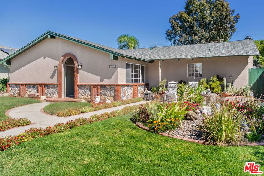 Lovely ranch style home on a quiet suburban cul-de-sac, lined with flowering pear trees. 4 bdrm/2.5 bath. Home features custom oak and maple cabinetry, remodeled country style kitchen, custom fireplace, warm colors, and tile flooring. Brick pool yard with a separate fenced courtyard and raised pond. Private electric gated parking with two car garage. Lovely neighborhood feel - come have a look!