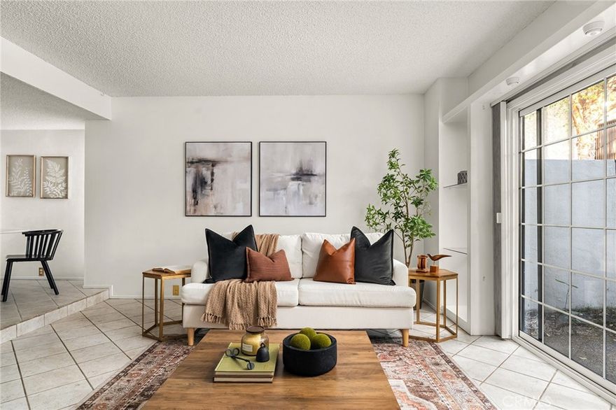 Welcome to Woodoak Condominiums - where Chico living meets convenience and charm!  This downstairs two bedroom, one bath condo offers one of the largest two-bedroom floor plans in the community and is perfectly tucked into a peaceful courtyard surrounded by mature trees and lush landscaping. Step inside and you’ll love the natural light that fills the sunken living room — a cozy, inviting space anchored by a fireplace and large sliding glass doors that open to your private patio.  The functional kitchen overlooks the dining area and living room, making entertaining easy.  Both bedrooms have plenty of space as well as two closets.  The main bedroom includes a convenient vanity with sink and mirror.  Woodoak residents enjoy fantastic amenities including a saltwater pool, hot tub, and sauna — plus a community laundry facility upgraded with Bluetooth technology for easy, modern convenience. The HOA covers water, garbage, and recycling, making this an effortless place to call home.  Located just steps from Bidwell Park and minutes to downtown and CSU Chico, this condo offers the best of comfort, convenience, and Chico charm all in one.