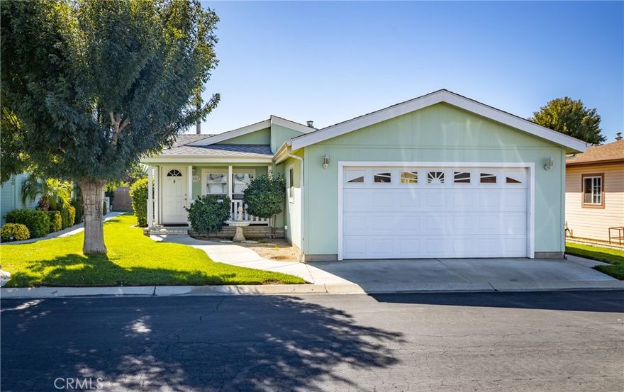 MOTIVATED SELLER! Lovely manufactured home located in the desired senior 55+ gated community of Foothills of Hemet, and as a bonus has an attached 2-car garage. Enjoy your mornings or evening on your porch overlooking your lush green yard & shade tree. Home has very spacious primary bedroom & bathroom w/step-in shower. Guest bedroom at the end of the hallway w/guest bathroom right next door to it. The third bedroom which has double door entry is being used as an office since it doesn't have a closet. Kitchen with new microwave & disposal is light & bright with lots of cabinetry that opens up to the dining and living room areas. Inside laundry room also has a pantry closet in it. Central air, evaporative cooler, and ceiling fans keep this home cool & comfortable. Energy efficient tankless water heater. Covered back patio for entertaining. The park is clean, quiet, gated and just plain awesome with amenities including 2 swimming pools, spa, pickleball courts, air-conditioned shuffle board court, exercise room, recreation hall w/kitchen, and rooms to enjoy billiards, cards, bingo, crafts & fun planned dinners or activities. Ask about the park's RV parking area. Commuter friendly, and close to shopping & restaurants.