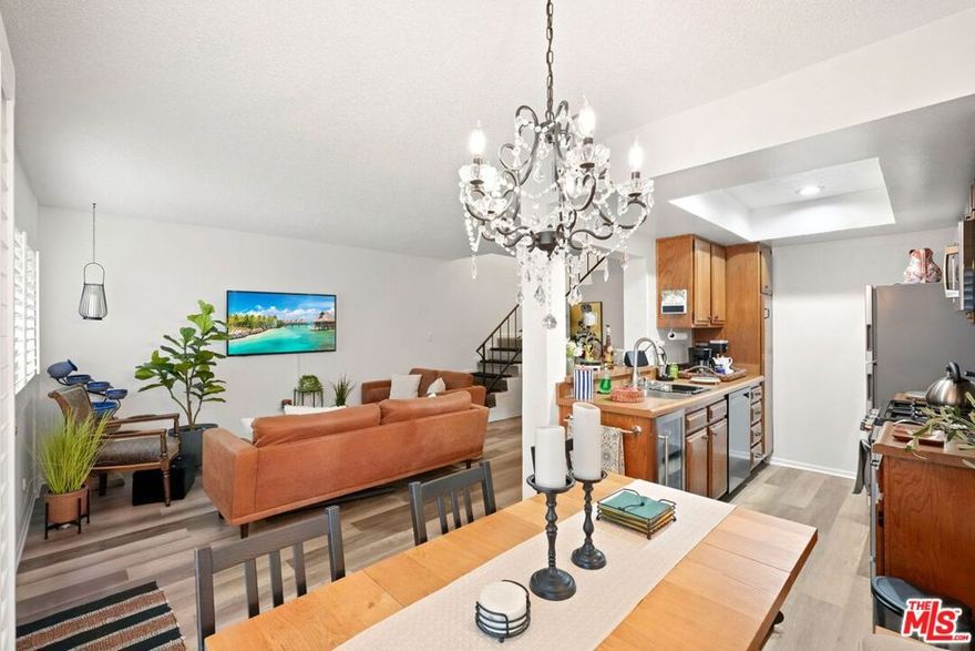 Welcome to this charming two-story townhome featuring 2 bedrooms and 2.5 bathrooms in the heart of Reseda! Step inside to a move-in-ready home offering luxury vinyl flooring, recessed lighting, and a new central air conditioning and heating system. The well-maintained kitchen features newer appliances, and just off the kitchen is a cozy breakfast area that opens to both the patio and living room, creating a comfortable flow for everyday living and entertaining. Upstairs, you'll find two spacious bedrooms, including a primary suite that offers a peaceful retreat with its private bath and huge walk-in closet. The attached two-car garage with direct access and washer/dryer hookups adds everyday ease and convenience. Community amenities include a sparkling pool and spa. With a low HOA and a prime location just steps from shops, restaurants, and everyday conveniences, this townhome truly has it all. Schedule your appointment today!