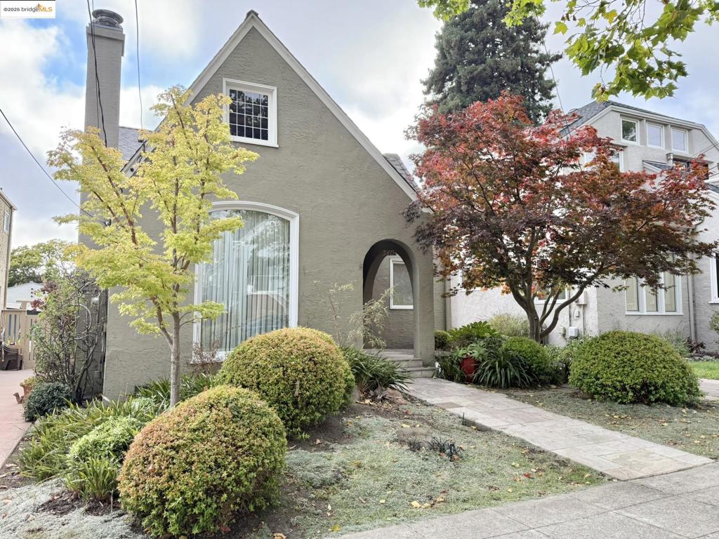 Fall in love with this 3/2 1920s gem on a storybook block where neighbors greet you by name and celebrate together. The first floor—nearly level-in—offers a cozy living room with fireplace, flowing through a graceful arch to a sunny dining area that’s open to the kitchen. Here are stainless steel appliances flush to cabinets, earth-tone quartz counters and a breakfast nook with a front garden view. Down the hall is a full bath, a bedroom with backyard views, and a second bedroom, configured as a bonus room, with sliding door to the yard. Upstairs, the huge en suite primary features vaulted ceilings, west-facing views, space for an office or art corner, a luxe bathroom, walk-in closet and laundry. A hidden attic nook offers potential for a tiny secret retreat. Extensively remodeled in 2007-08, guided by an architect and structural engineer, the home is sturdy and stylish with beautiful details and hardwood floors throughout. Outdoors, a stone patio framed by blooming dogwood, bougainvillea and a lemon tree—is perfect for al fresco dining. The detached garage fits a small car or storage, with a long driveway for off-street parking. Close to shops, restaurants, Farmer’s Mkt at Colusa Circle, Solano Ave, parks, and BART, this is home—and community—in the true sense of the word.