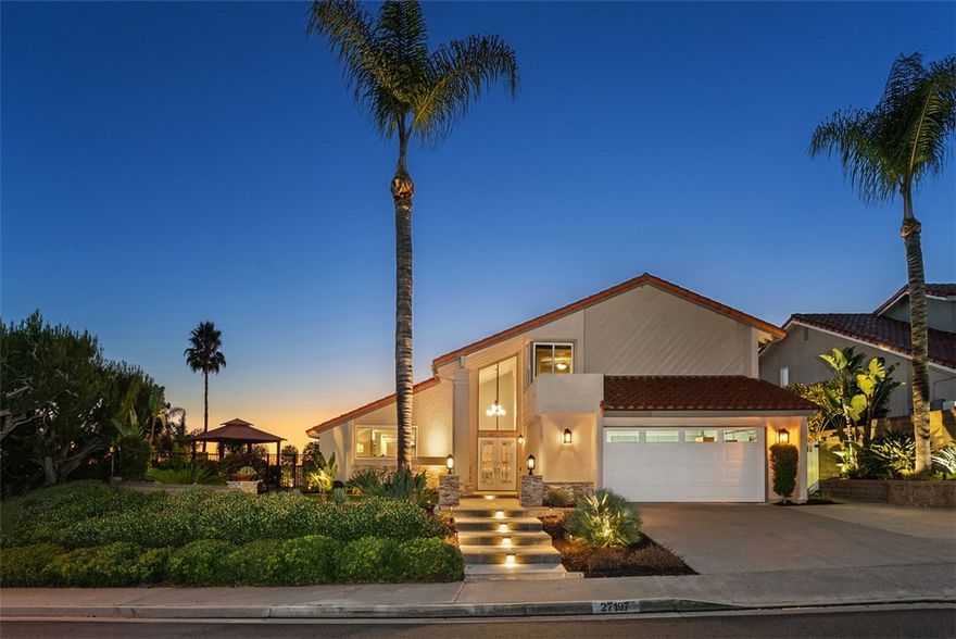 Panoramic Perfection: Turnkey Luxury on a Coveted Mission Viejo Street A rare opportunity awaits on one of Mission Viejo's most sought-after cul-de-sacs. Perched high on a premium corner lot, this pristine & fully remodeled residence captures an expansive 270-degree panoramic view that sweeps from the sparkling coast to nightly Laguna Canyon sunsets and Disneyland fireworks. This home is a true masterpiece that has been meticulously upgraded & maintained to the highest standard. It offers the ultimate blend of luxury living & breathtaking views. The exceptional condition and high-end upgrades define this property. A gourmet chef’s kitchen is the heart of the home, designed for both serious cooking & elegant entertaining. It features premium Thermador WiFi appliances, hand-picked tile accents, a beadboard ceiling, & a massive 10' quartz island complete with generous storage & a dedicated wine & beverage fridge. The open-concept living & dining areas flow seamlessly through multiple sets of sliding glass doors, turning coastal views into your daily backdrop. Step outside to an entertainer’s dream where the sweeping vistas take center stage to create a true sanctuary for year-round gatherings. The resort-style backyard offers a saltwater pool & spa with a waterfall feature, an outdoor kitchen incl. a built-in BBQ island and beverage fridge, a fire pit, multiple refined seating areas, and a gazebo tucked within the beautifully landscaped side garden. The home’s impeccable condition is reflected in its extensive list of renovations, including a PEX re-pipe, new HVAC, and comprehensive upgrades. The front-yard enjoys new hardscaping, stone accents, and landscape lighting to provide impressive curb appeal. The nearly 8,000 sq ft lot offers not only privacy but also the potential to add an ADU. On the main level, a fourth bedroom with serene views is currently used as a stylish office. Upstairs, the primary suite features two walk-in closets, an ensuite bathroom, and a private balcony. Imagine starting your day by taking in the mountain landscapes or enjoying your evening surrounded by the sparkle of the city lights below. Mission Viejo's residents enjoy exclusive Lake Mission Viejo privileges including boating, beaches, concerts, and lakeside dining all Around the corner.  This is more than just a home; this property is a refined expression of luxury, meticulous care, and the kind of view-centric living that turns everyday moments into something extraordinary.