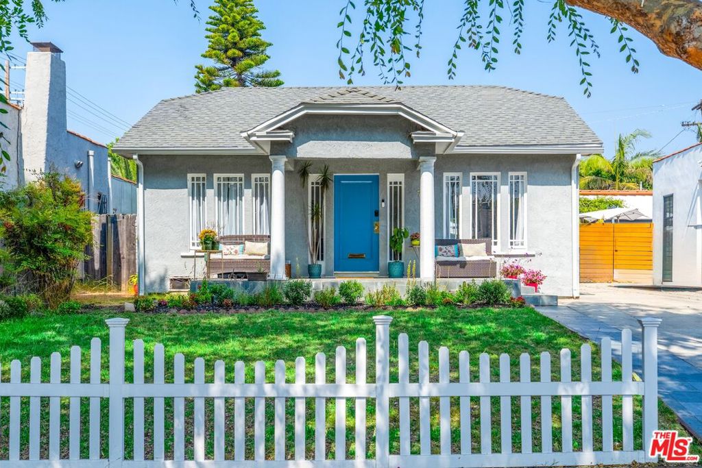Just listed in Melrose Village! This California Craftsman Bungalow offers the perfect blend of 1920s charm with modern updates and a huge backyard. The bright, open layout features rich walnut hardwood floors, a large open layout living room, custom built-ins, a decorative fireplace, modern appliances, and a dining room and breakfast nook. Complete with 3 bedrooms and 3 bathrooms, the spacious primary suite includes a walk-in closet with French doors that lead to a large & private backyard. This is the perfect abode for relaxing, entertaining, and future expansion. Whether you're looking for a move-in-ready home in a prime location that's close to West Hollywood, Hollywood, the Grove, Fairfax & Beverly Hills or you want to develop your own home. This property offers exceptional potential to grow, add square footage, or even build a pool. Located in one of LA's most walkable neighborhoods, Melrose Village features some of the best restaurants, bars, cafes, boutiques, and fitness studios. You are in the epicenter of it all. Welcome home.