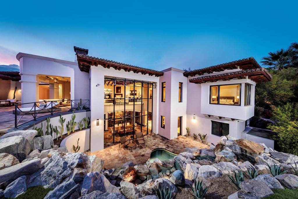 This fantastic home has recently been re-imagined with furniture, fixtures and landscaping. Terrific open floor plan with outdoor living, infinity edge pool and your private putting green. Unobstructed south exposure with views of the Canyons #2 fairway and the Santa Rosa Mountain range beyond. This home lives well for a couple, with master suite, office, one guest suite, great room and kitchen all on the main level. Lower level features game room with full bath, wine grotto with dining table and theater with powder bathroom. Separate entry guest house features two suites with a shared living room and kitchenette. Private dog park accessed from inside office or guest house. Professional chef's kitchen plus catering kitchen, as well as outdoor BBQ center. Additional amenities include a wet bar, a 'locker room' for storage right off garage and guest powder baths on each level. Offered furnished, excluding artwork.