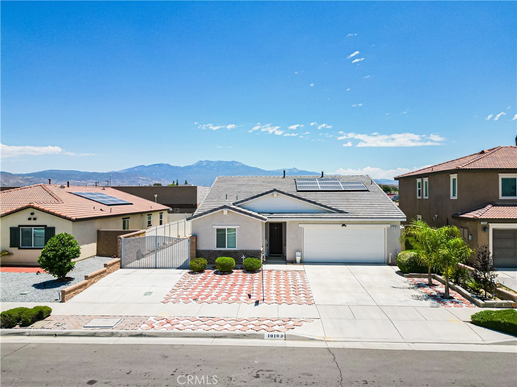 Welcome Home to 1010 Battersea Road – Fully Upgraded & Move-In Ready! Perfectly situated in a quiet Hemet neighborhood, this beautifully upgraded single-story home offers the ideal blend of style, space, and convenience—whether you’re a first-time buyer ready to plant roots or a retiree looking for easy, low-maintenance living. Step inside and be greeted by a light-filled open floor plan that flows effortlessly from room to room. The heart of the home is the stunning kitchen featuring sleek stainless steel appliances, granite countertops, and modern shaker cabinetry—perfect for everyday meals or entertaining guests.The oversized master suite is your private retreat, complete with a spacious walk-in closet and a luxurious ensuite bathroom with dual vanities and a large walk-in shower. Two additional bedrooms and a second full bath provide flexibility for family, guests, or a home office. Outside, enjoy a hardscaped backyard and low-maintenance landscaping that gives you more time to relax and less time on upkeep. The property also features dedicated RV parking with ample space for both an RV and a boat—a rare find! Additional highlights include: Built in 2019 — move-in ready with modern systems, no HOA or Mello-Roos, energy-efficient paid-off solar, attached 2-car garage and extended driveway, and quiet-walkable neighborhood with mountain views. This home checks all the boxes for comfort, functionality, and long-term value. Don’t miss your opportunity to own a home that fits your lifestyle now—and for years to come. Schedule your private showing today and discover why 1010 Battersea Rd is the one you’ve been waiting for!