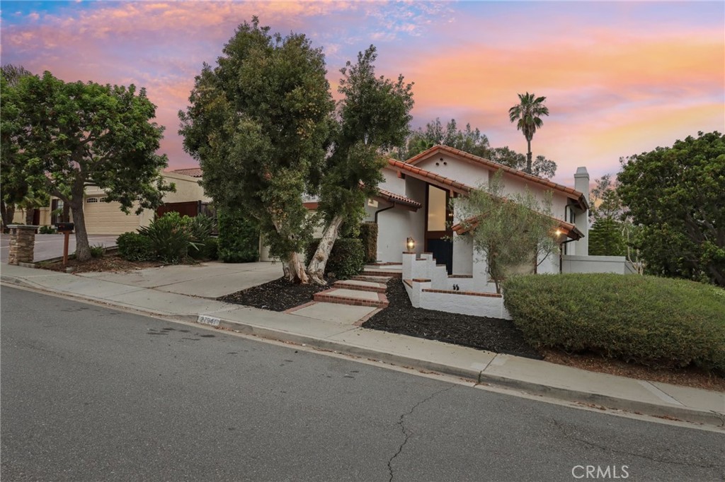 Great price point home in Los Corrales area San Juan Capistrano, located in the sought-after community with no HOA fees. The home is the perfect blend of classic California Spanish architecture and modern design. This 2,885 square foot home is situated on a substantial 11,200 square foot lot, and offers striking views of the hills and valley below. The main level features a grand living room, dining area and family room along with a downstairs bedroom & bathroom. The backyard is massive and ready to create your dream backyard. The second level comprises two guest bedrooms and a fabulous primary suite featuring cathedral ceiling, two large closets, and a primary bathroom with its own balcony perfect for enjoying a morning coffee. Additionally, just minutes from the charming downtown of San Juan and the historic Los Rios District, a vibrant community awaits surrounded by access to hiking, mountain biking, and equestrian trails. Enjoy close proximity to major freeways, medical facilities, the San Juan Hills Golf Club, Dana Point Harbor, and the stunning beaches of South Orange County!