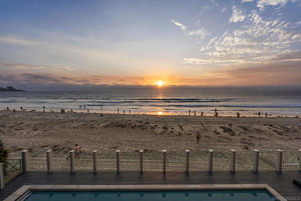 Rare, on-the-sand, La Jolla Shores beachfront estate to rent! This oceanfront home offers unobstructed panoramic views of the Pacific from Scripps Pier to The Village coastline, setting the stage for front-row views of magical sunsets, playful dolphins, and beach time fun. Sunlit interior spaces complement fabulous exterior entertaining and relaxation areas including a nearly unheard of beach-front pool and multiple west-facing decks. Mornings begin with salt air and seabirds overhead. Afternoons invite spontaneous strolls along the sand to the La Jolla Beach & Tennis Club. Evenings end with the sun dropping behind the horizon, framed perfectly from nearly every angle. This is an absolute must-see!