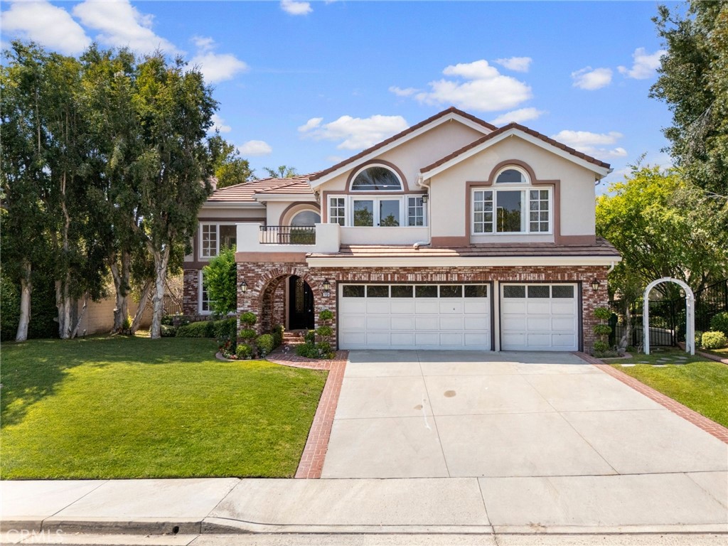 Stunning, fully upgraded residence offering 5 bedrooms, 4.5 baths and an oversized 3-car garage, privately positioned on an 11,050 sq ft lot inside the guard-gated community of Coto de Caza. A pair of 8-foot wrought-iron doors opens to an airy great room with cathedral ceilings, custom paint, a stone fireplace and imported Italian tile that flows into a formal dining room framed by French doors to the yard.
The re-imagined chef’s kitchen showcases sleek European cabinetry, quartz counters, stainless-steel appliances, a center island, breakfast bar and walk-in pantry, seamlessly connecting to a generous family room finished with Danish hardwood floors, custom built-ins and a second fireplace overlooking lush greenery.
A main-floor guest suite with full bath is perfect for visitors, while a dedicated laundry room and stylish powder bath add convenience. Upstairs, dual primary suites provide luxury retreats: one enjoys treetop vistas, a jetted soaking tub, spa shower, split touch-light vanities and custom walk-in closet; the other offers its own full bath—ideal for multigenerational living. Two additional bedrooms share an upgraded hall bath, and a fifth room flexes easily as an office, gym or nursery.
Entertain outdoors beneath California skies in the beautifully landscaped backyard featuring redwood fencing, expansive brick patio, BBQ stub, citrus trees and plenty of lawn for play or pets. Modern systems include dual A/C units, high-efficiency furnace, dual water softeners, whole-house filtration, updated plumbing fixtures and LED lighting. The finished 3-car garage provides abundant cabinetry and overhead storage.
Residents enjoy miles of hiking, biking and equestrian trails, two private golf courses, sports parks, pools and award-winning schools, all minutes to shopping, dining, toll roads and beaches. Low HOA and no Mello-Roos. This turnkey sanctuary blends timeless design with today’s most desired amenities—move right in and live the resort lifestyle!