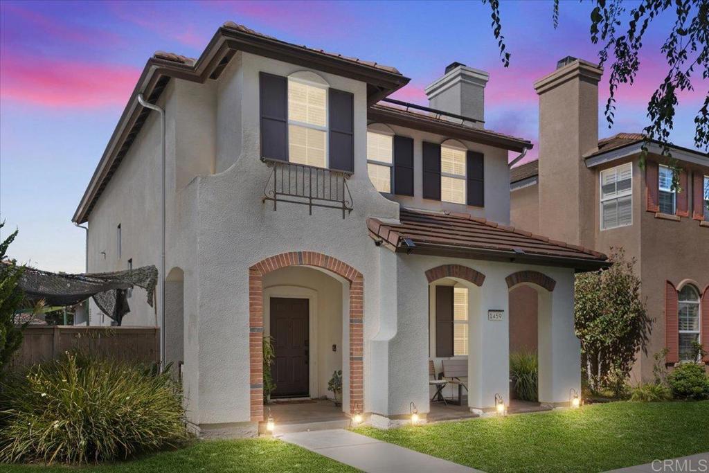 Welcome to this beautifully upgraded 3-bedroom, 2.5-bath home in the heart of Otay Ranch. Offering 1,664 sq ft of thoughtfully designed living space, this two-story residence features an open-concept layout with tile and hardwood flooring, spacious living and dining areas, and a stylish kitchen with quartz countertops, and shaker-style cabinetry. Modern conveniences include WiFi-controlled lighting throughout, energy-efficient solar panels, and a garage equipped with extensive built-in storage cabinetry and durable epoxy flooring. The upstairs primary suite is light-filled and versatile, offering space for a home office or fitness nook. Step outside to a private backyard oasis featuring a custom wood pergola and stamped concrete patio, perfect for entertaining or quiet evenings outdoors. This home offers low-maintenance landscaping, and a location that’s close to Veterans Elementary, Santa Venetia Park, and the community pool and playground. Plus, you're minutes from Otay Ranch Town Center, shops, dining, and much more. This move-in ready home combines comfort, efficiency, and location. Schedule your tour today!