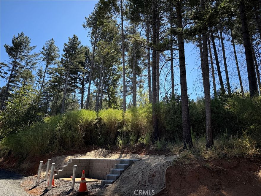 Build your vision on Granada Drive in scenic Magalia. This inviting lot offers a unique opportunity to create your ideal home in a peaceful wooded setting just minutes from the clear waters of Paradise Lake. Whether you dream of a quiet retreat, a full-time residence, or a weekend escape, this property offers the space and setting to make it real. Surrounded by natural beauty and located in an established neighborhood, the lot combines privacy with convenience. Close to local amenities, hiking trails, and recreational spots, it's the perfect place to bring your plans to life in this beautiful part of the ridge.
