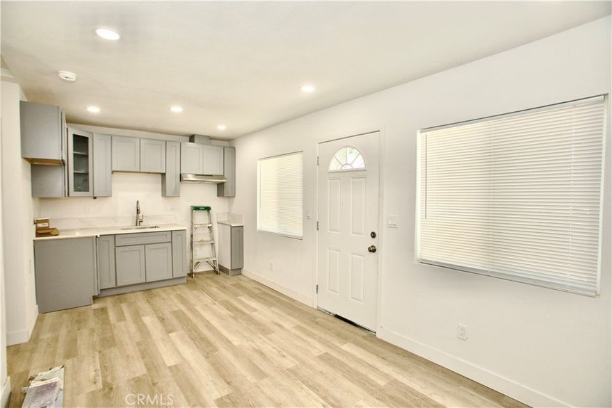 Welcome home to this beautifully reimagined 1 bedroom, 1 bath ADU tucked away in the sought-after Arrowhead Farms community of San Bernardino. What was once a simple garage has been completely rebuilt into a fresh, modern space with thoughtful details and comfort in mind. From the moment you step inside, you’ll notice everything is brand new — walls, insulation, drywall, and recessed lighting that creates a warm and inviting feel. The open kitchen features sleek quartz countertops and a brand-new electric stove, perfect for whipping up your favorite meals. Just off the kitchen, you’ll find a bright and airy living area designed for relaxation or study. The bedroom offers a cozy retreat at the end of the day, while the newly designed bathroom is complete with modern fixtures and finishes for a spa-like experience. For convenience, the unit includes an in-home washer and dryer, so laundry days are simple and stress-free. Every detail has been crafted to give you a sense of ease, privacy, and comfort. Beyond the walls of your new home, you’ll love the prime location. Nestled in Shandin Hills, you’re only a short drive to Cal State San Bernardino, making this the perfect home base for students, faculty, and professionals alike. With quick access to local shops, dining, and major freeways, you’ll have everything you need right at your fingertips. Whether you’re starting fresh on your own or looking for a stylish, low-maintenance place to call home, this ADU offers a lifestyle that blends modern living with everyday convenience.