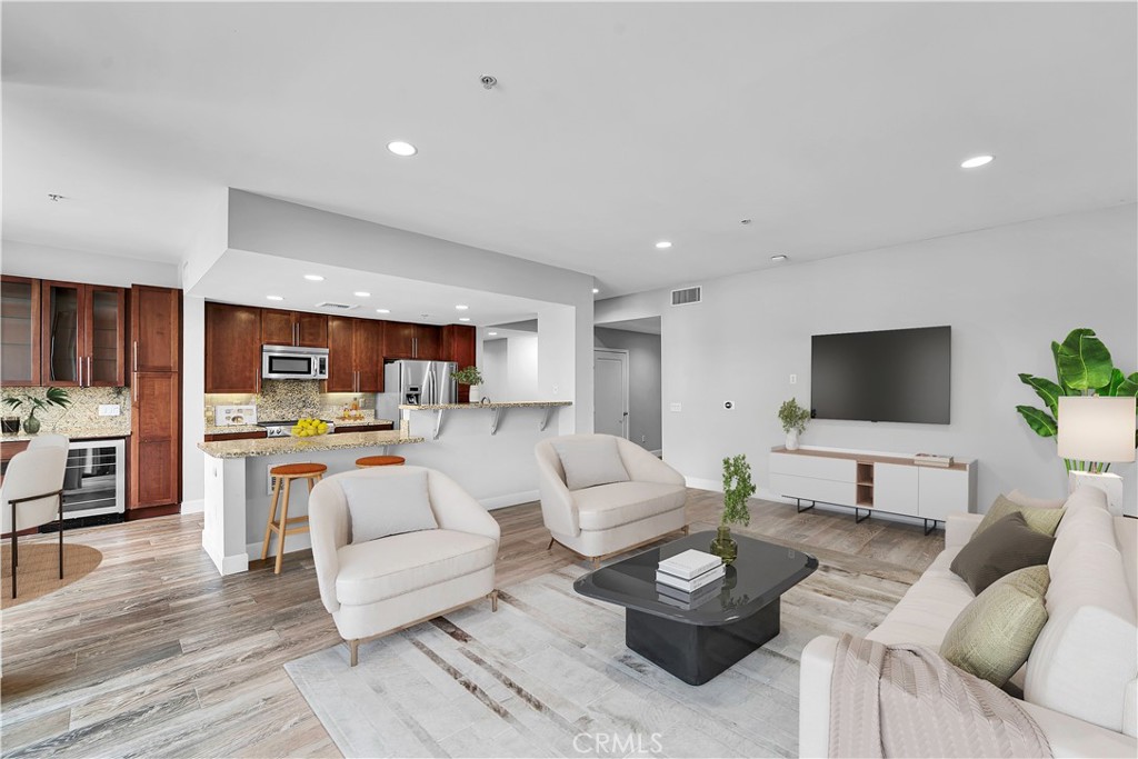 **Unit is eligible for a $20,000 closing credit(grant) through City National Bank's "Ladder Up" program**
Ready for your own sizable haven in a prime walkable location in downtown Long Beach? Welcome to Unit #204 at Blu Condos, a rare 3-bedroom, 2-bathroom corner unit offering 1,620 sq ft of contemporary living space in the vibrant East Village Arts District. Built in 2008, this home boasts windows on three sides, flooding the space with natural light and sharing only one common wall for enhanced privacy.
The three spacious bedrooms include ample storage, and the primary suite offers a double vanity with a large shower, soaking tub, and walk-in closet. With a sizable open-concept living room, dining room, and kitchen, this home is made for someone who is ready to entertain. The wine fridge and bonus bar area offer a classy addition of functional space, adding a mature ambiance to this downtown retreat.
As one of the largest corner units in the building, the space features windows on three sides and a balcony just off the living space offering ample natural light and warmth to the home.
On top of the community gym, library, reservable private recreation room, and outdoor patio and grilling spaces, the owner of this home can enjoy the convenience of two side-by-side reserved parking spots just a short elevator ride away. There is in-unit laundry, extra storage both inside and on the balcony, and guest parking available in the gated garage. The complex also has fingerprint entry technology, FOB access, and security cameras.
Situated in downtown Long Beach, you're steps away from eclectic dining, shopping, and entertainment options—this unit is close to everything without being in the middle of it all. With a Walk Score of 98, daily errands and entertainment activities are easily accessible on foot.
Experience the perfect blend of modern living and urban convenience in this exceptional condo. Priced to make room for the buyer's personal additions and style updates, don't miss the opportunity to make Unit #204 your new home.
*Photos are digitally staged