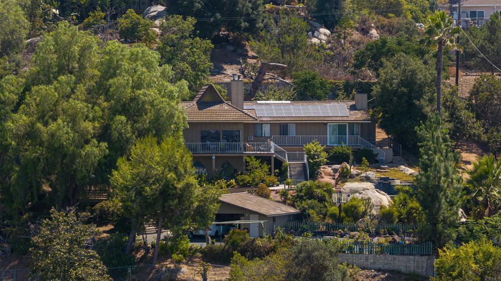 A must see! One of a kind property with a breathtaking, panoramic million dollar view! The stunning yard on this 1.22 acres lot has a private road, private gate, walking trails, pool, fish pond, established trees and a variety of fruit trees. This house offers a hamonious and serene outdoor lifestyle, featuring solar system, sparkling pool, relaxing jacuzzi plus an ADU for extended family or additional income. It's like Lake Tahoe in El Cajon! Don't miss the apportunity to own this property. Truly a one-of-a-kind gem. Come to make it yours!