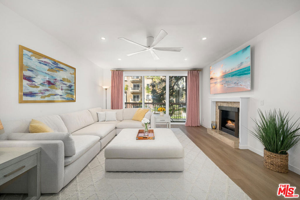 Beautifully renovated 2 bed + 3 bath corner unit in the highly sought-after Westwood Marquis. This single-level residence offers a spacious open floor plan with high ceilings, recessed lighting, and abundant natural light. A formal entry leads to a generous living room with a stack-stone fireplace, built-in bar, and floor-to-ceiling sliding glass doors opening to a private covered balcony. The updated kitchen features white cabinetry, quartz or granite countertops, stainless steel appliances, and a breakfast nook. Bedrooms are thoughtfully positioned on opposite sides for privacy, each with its own ensuite bath. The primary suite includes a large walk-in closet and a spa-like bath with a soaking tub and separate glass-enclosed shower. Additional features include in-unit side-by-side laundry, central HVAC, smart home integration, and remote-operated window treatments. Two side-by-side garage parking spaces, dedicated EV charger, and extra storage. The secure building offers resort-style amenities including a pool, spa, sauna, and club room. Ideally located on a tree-lined street just moments from Westwood Village, UCLA, Sawtelle, and the best of West LA dining, shopping, and parks.