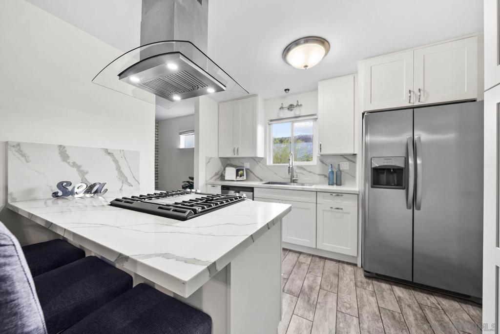 Welcome home to this wonderful retreat nestled peacefully on the border of Santee & Fletcher Hills this spacious 4 bedroom 2 bath home offers an astounding 2,102 sq ft of comfortable living space on a generous .3-acre lot. Ideal for seeking a blend of suburban tranquility and vibrant community life, this residence is just minutes from top-rated schools, parks, and a wealth of recreational activities. The expansive floor plan seamlessly connects the living, dining, and kitchen areas, creating an inviting space for family gatherings and entertaining guests. Updated throughout, this home has a gorgeous kitchen, modern bathrooms, and a large backyard with she-shed, offering a blank canvas for outdoor enthusiasts perfect for gardening, play, or relaxation. Also boasting a spacious driveway & garage providing ample parking and storage solutions including potential RV parking. Located just east of San Diego, Santee offers easy access to major highways 125 & 52, many shopping centers (Costco/Target/and many more), lots of dining options, and entertainment venues, all while maintaining a peaceful suburban environment. All the more reason to call this HOME! A few local perks include: Santee Lakes Recreation Preserve, this 190-acre park features seven scenic lakes, picnic areas, fishing spots, and walking trails.Big Rock Park & Mast Park: These local parks offer playgrounds, sports fields, and open spaces for picnics and community events. Santee Boulders: A unique spot for climbing enthusiasts to enjoy outdoor bouldering in a natural setting. Cameron Family YMCA & Sportsplex USA: Nearby recreational centers offering a variety of programs, including swimming, sports leagues, and fitness classes. Santee hosts a variety of events throughout the year, fostering a strong sense of community: Summer Concerts & Fido Fest: Enjoy live music and community gatherings during seasonal events organized by the Santee Recreation Department. Youth Programs: The Teen Center at Big Rock Park offers after-school programs, including homework assistance and recreational activities for teens.