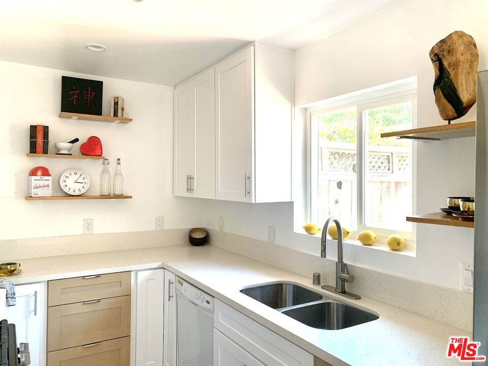 Newly Renovated 2BR/1.5BA Condo ideally located in a quiet Gated Studio City Community. Brand-New Kitchen & Bath. This unique urban living near shops and freeways offers a private garden in front and a tiled patio in the back, adjacent to the covered car port. With approximately 1,000 sq. ft. two-story condominium you get the perfect balance of indoor comfort and private outdoor living. Features Include:*Brand-new kitchen with modern cabinets, numerous outlets, extended quartz countertops, new double door refrigerator and stove, range hood and dishwasher. *New upstairs bathroom with exquisite tiles and fixtures*Newly renovated interior with premium flooring, fresh paint, and upgraded electrical*Spacious open floor plan on the first level with living/dining area and powder room*Two bedrooms and a full bathroom on the second floor with abundant natural light*Washer/dryer hookups in unit or laundry in building*Upgraded central air conditioning and heating*Generous closet and storage space throughout* Community Highlights:*Secure, gated access*Outdoor pool right within the condo complex*Guest parking available*Landscaped pathways and green spaces*Property backs to the L.A. River trail a scenic walking and biking path*Convenient access to major freeways, shops, dining, and entertainment options.Lease Terms:*No pets*No smoking*No subleasing or short-term rentals*Renter's insurance, income verification, and security deposit required.